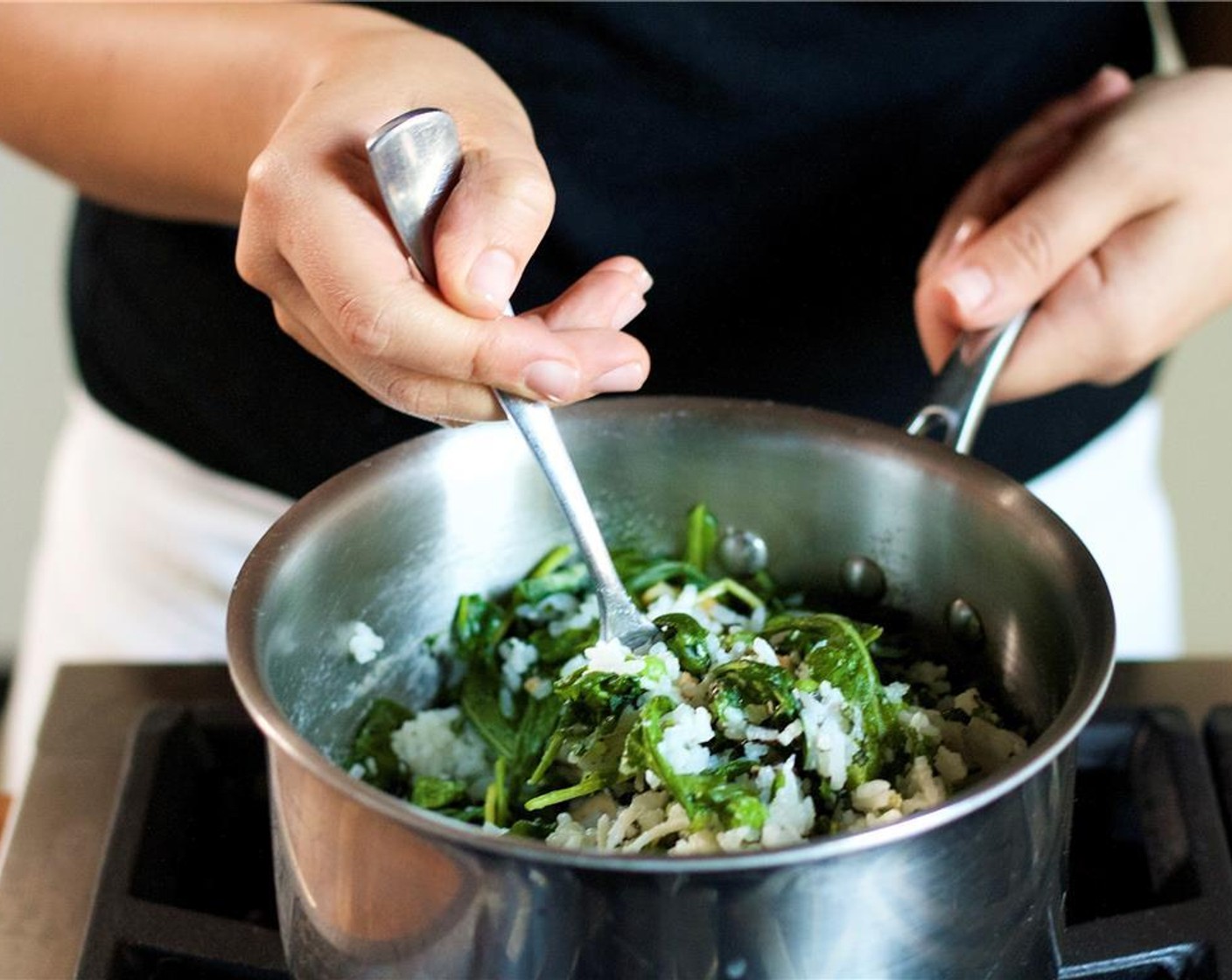 step 11 Meanwhile, in the same pan as the rice, mix together the cashews, Green Peas (1/2 cup), mint, basil, Unsweetened Coconut Flakes (2 Tbsp), Baby Arugula (1 1/2 cups), Salt (1/4 tsp) and Ground Black Pepper (1/4 tsp). Keep warm until plating.