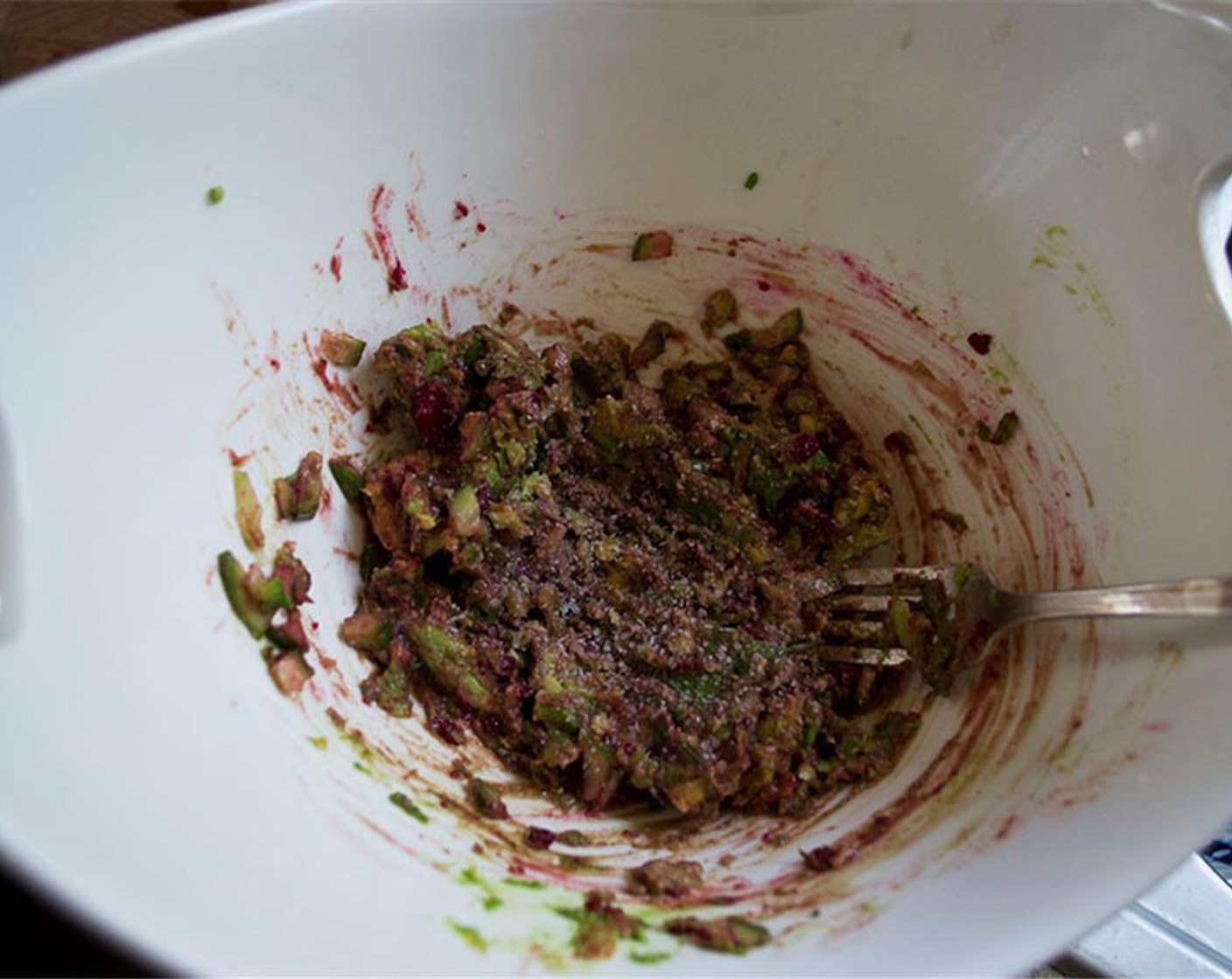 step 11 In a bowl, mash the flesh of the Avocado (1), the minced serrano, minced onion, chopped cucumber, prickly pear, and chopped cilantro stems. Season with Salt (to taste) and juice of the Lime (1).