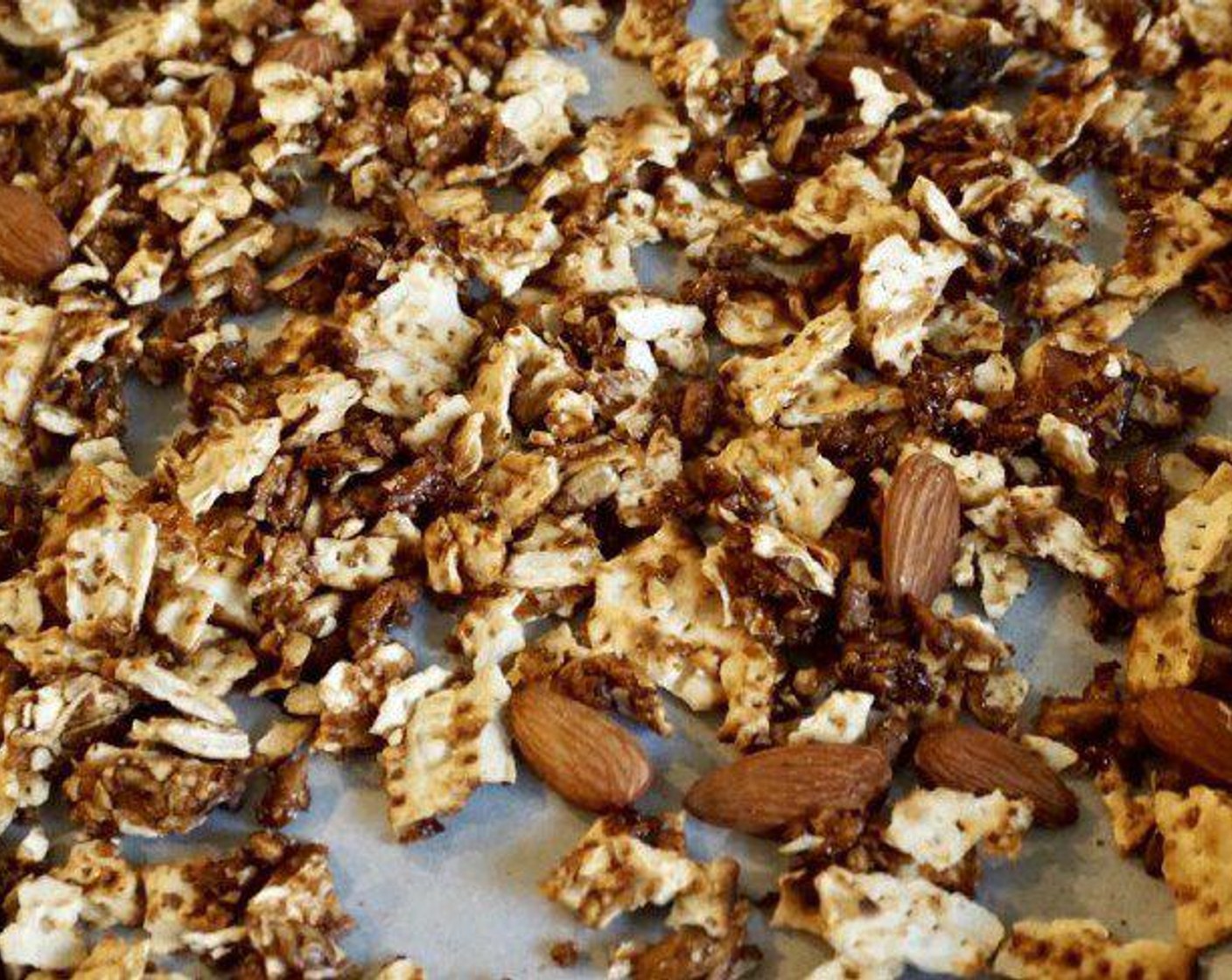 step 2 Stir together Matzo (2) with Sunflower Seeds (1/2 cup), Unblanched Whole Almonds (4 Tbsp) , Safflower Oil (2 Tbsp), Brown Sugar (2 Tbsp), Maple Syrup (2 Tbsp),Sea Salt (1/2 tsp),and Vanilla Extract (1/4 tsp). Spread the mixture in a thin layer on a baking sheet lined with parchment paper.