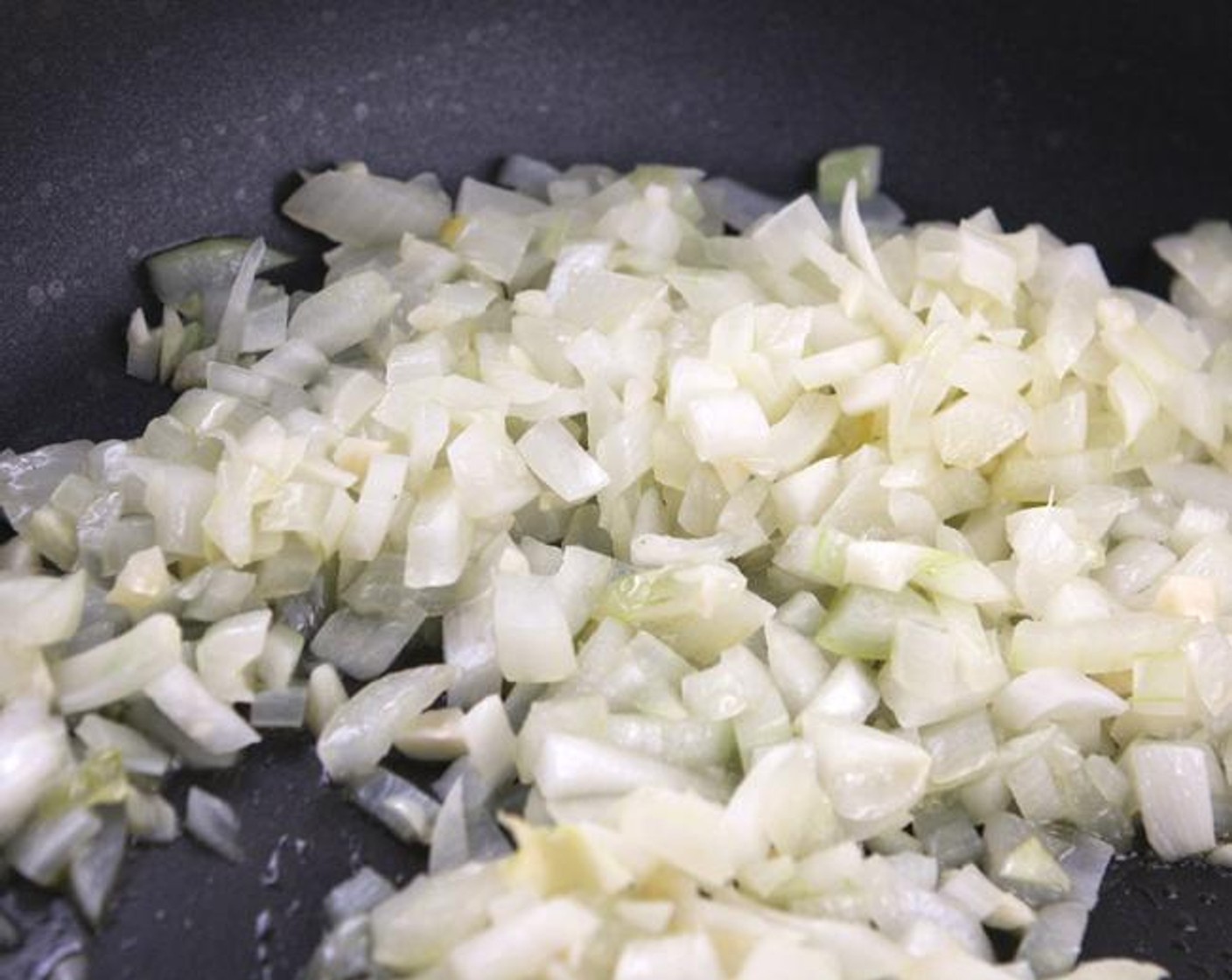 step 2 Heat the Extra-Virgin Olive Oil (1/3 cup) in a large skillet over medium heat. Cook the Yellow Onion (1) and Garlic (2 cloves) until tender, 3 to 5 minutes.