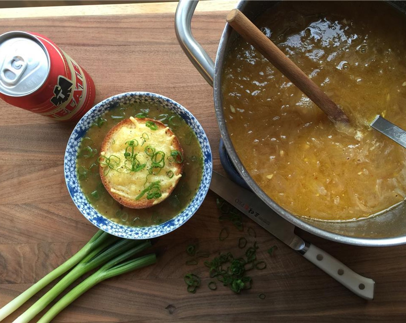 step 16 Ladle soup into bowls. Top with that cheesy roll and sliced scallion. Enjoy folks!