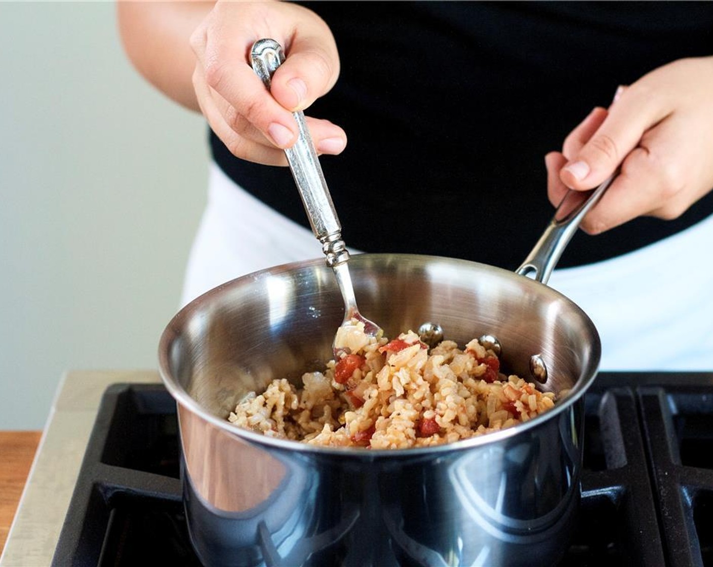 step 8 Add Brown Rice (2/3 cup) and chicken broth. Stir and cover. Cook rice for thirty five minutes or until all liquid has been absorbed. Remove from heat, fluff rice with a fork, and set aside.