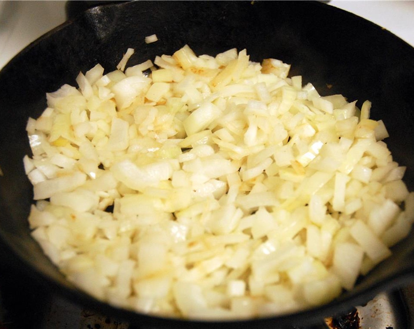 step 7 Return pan to medium heat, and add the remaining Olive Oil (1 Tbsp). Add the remaining half of the onions, and cook while stirring until fully translucent, about 6-10 min.