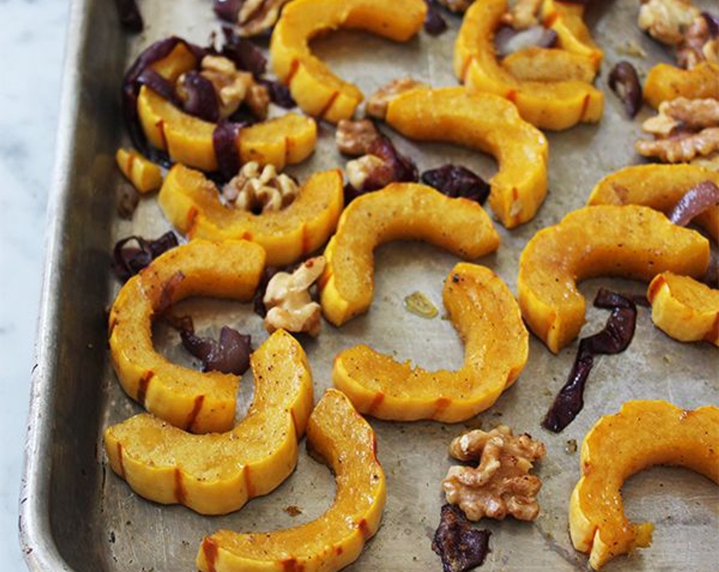 step 4 Roast for 15 minutes. Add the Raw Walnuts (2/3 cup) to the sheet pan, toss, and roast for another 10 minutes, until the squash is tender and browned and the nuts are toasted.