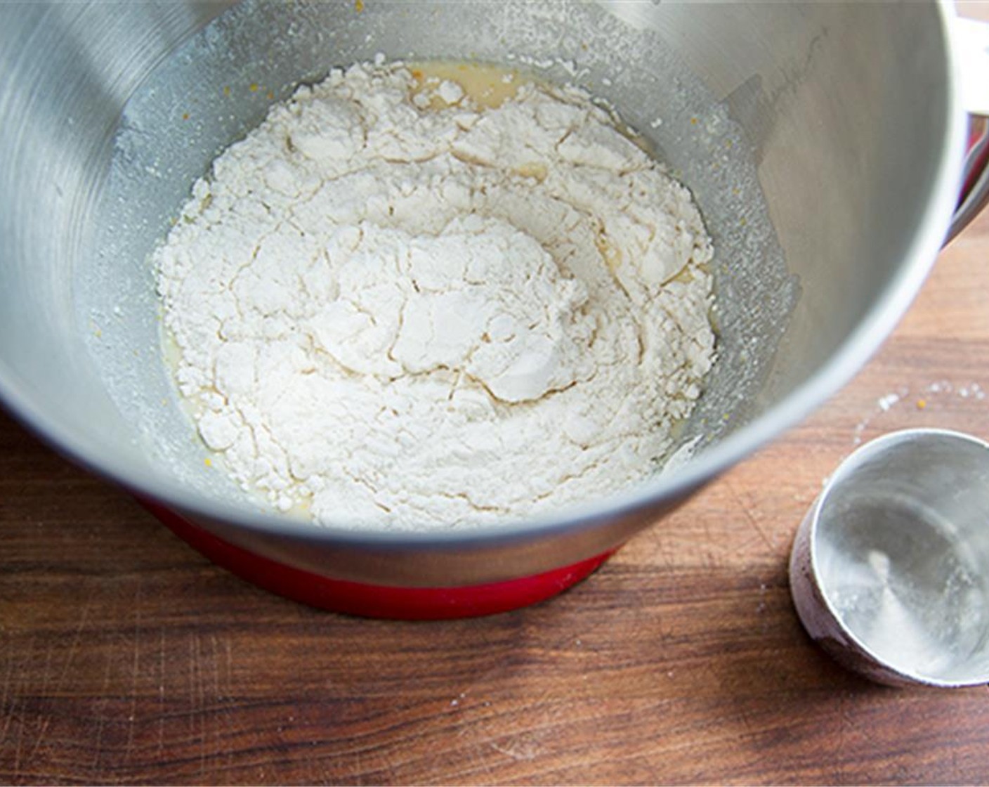 step 3 With a mixer slowly mix 2 cups of All-Purpose Flour (3 1/2 cups) into above mixture until moist dough has formed. Beat in remaining flour until the dough becomes stiff.