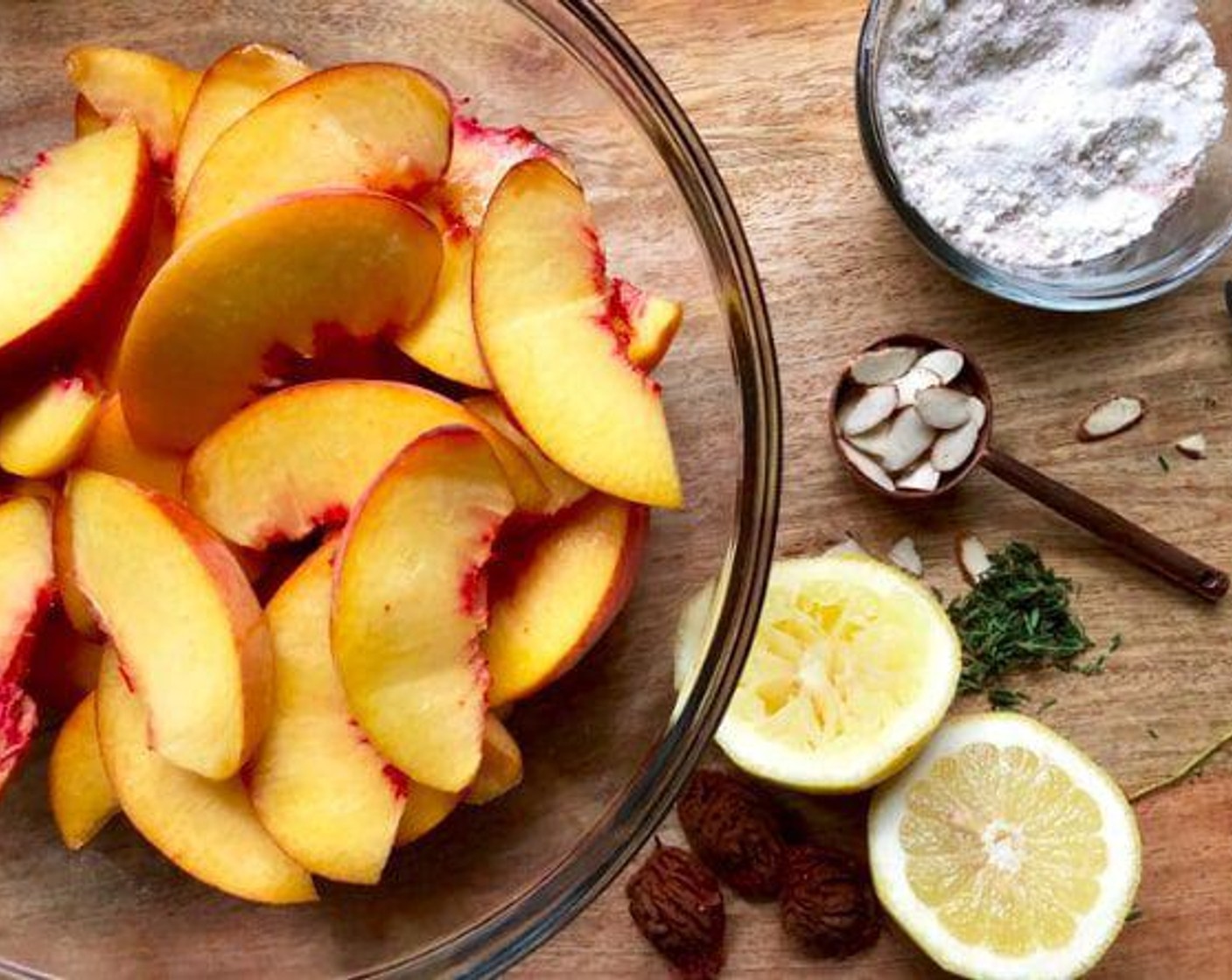 step 6 For the filling, add the Yellow Peaches (3 cups) and juice from Lemon (1) to a large bowl. Toss until coated.