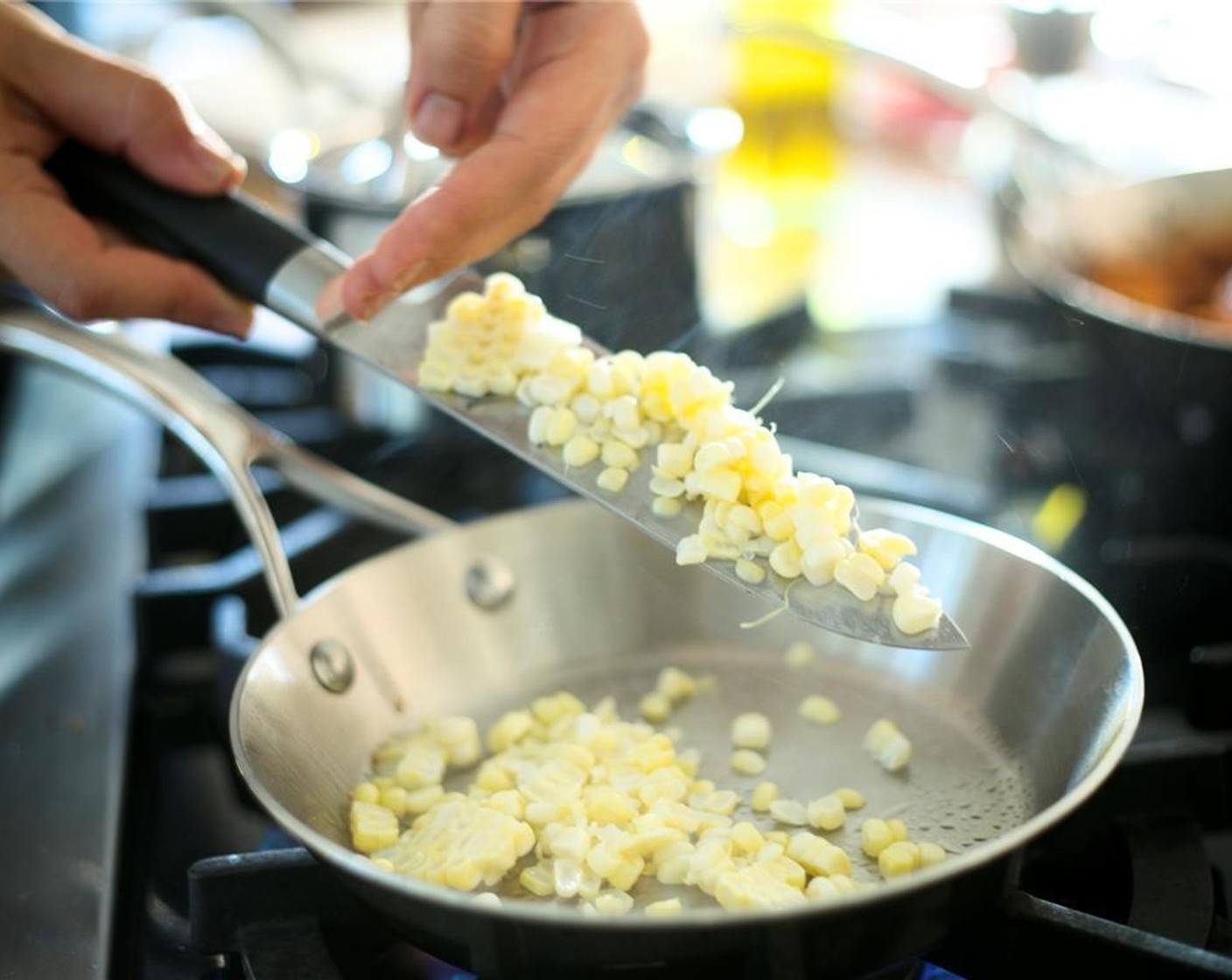 step 14 Heat a small saute pan over medium heat with Extra-Virgin Olive Oil (1 tsp). Add corn kernels and cook until golden brown.