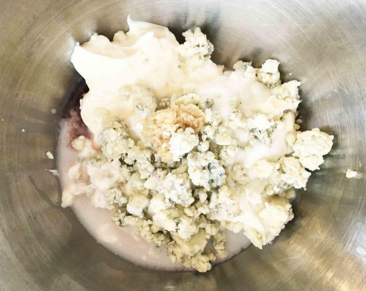 step 2 Place the Light Mayonnaise (1/2 cup), Nonfat Plain Greek Yogurt (1/2 cup), Gorgonzola Cheese (1/4 cup), 2% Reduced Fat Milk (0.5 fl oz), Port Wine (0.3 fl oz), and minced garlic into a medium bowl and stir together to combine. Season with Salt (to taste) and Ground Black Pepper (to taste).