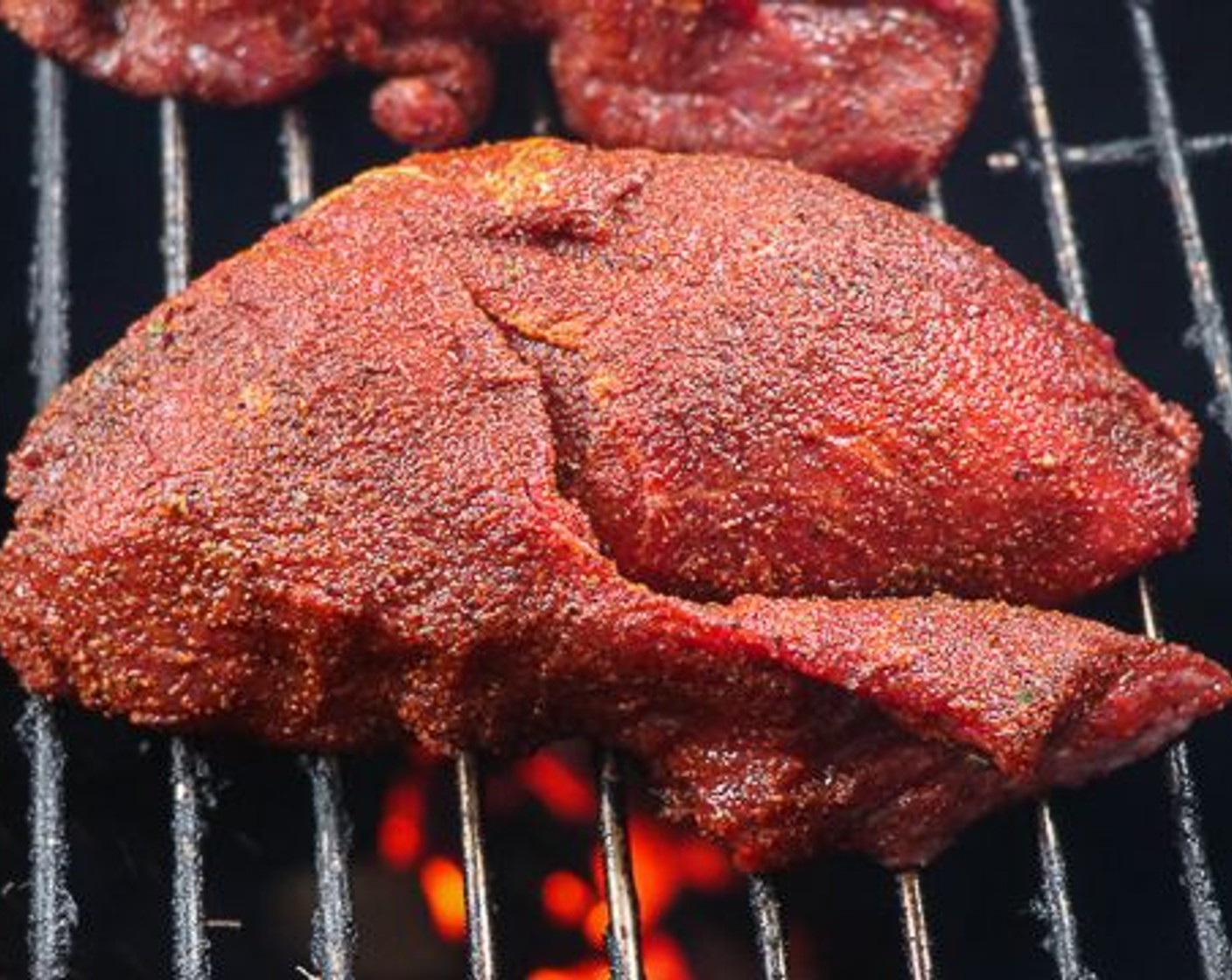 step 3 Place beef cheeks on pit and smoke for 2 hours.