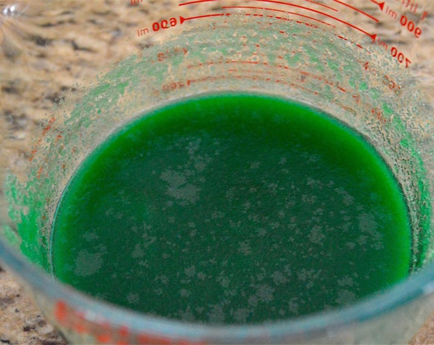step 2 Combine the Water (1/2 cup). Mint Extract (4 Tbsp), and Green Food Coloring (1/4 tsp) in a big bowl and stir it all together.