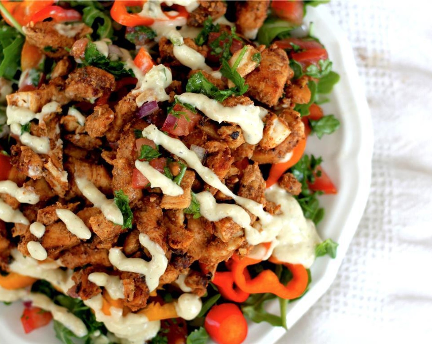 step 9 Toss together your Salad Greens (to taste), some tabbouleh, Baby Bell Peppers (to taste) and any other vegetables you want. Add the dressing and warm chicken and serve.