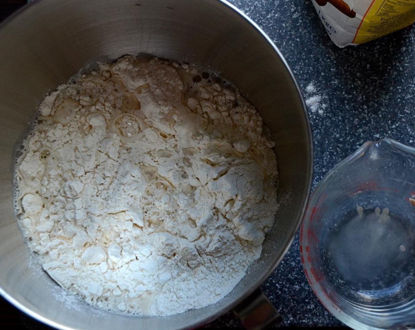 step 3 Add the yeast to the dough and turn the mixer onto a low setting. Knead the dough on low speed for 5 to 6 minutes.