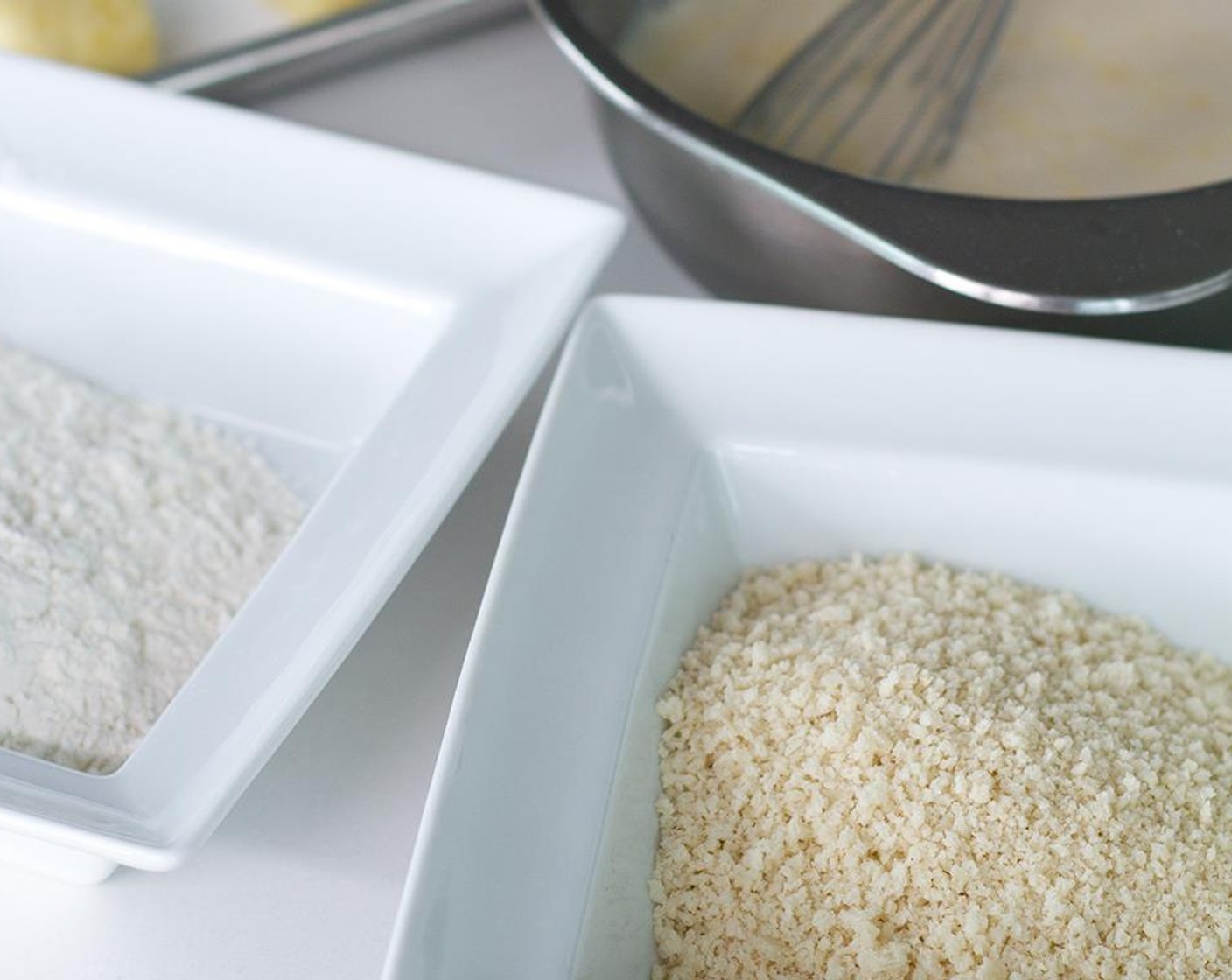 step 8 Put the Panko Breadcrumbs (1 cup) in a seperate bowl. Prepare the eggwash by whisking together the Eggland's Best Classic Egg (1) and the Milk (1/2 cup) in a small bowl.