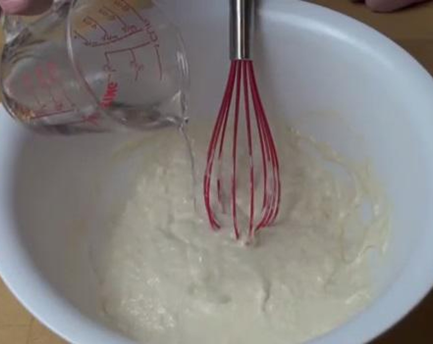 step 3 After an hour, add another Water (1/2 cup) with Baking Soda (1/4 tsp) and whisk the dough together. Cover that up again and leave it up for about an hour.