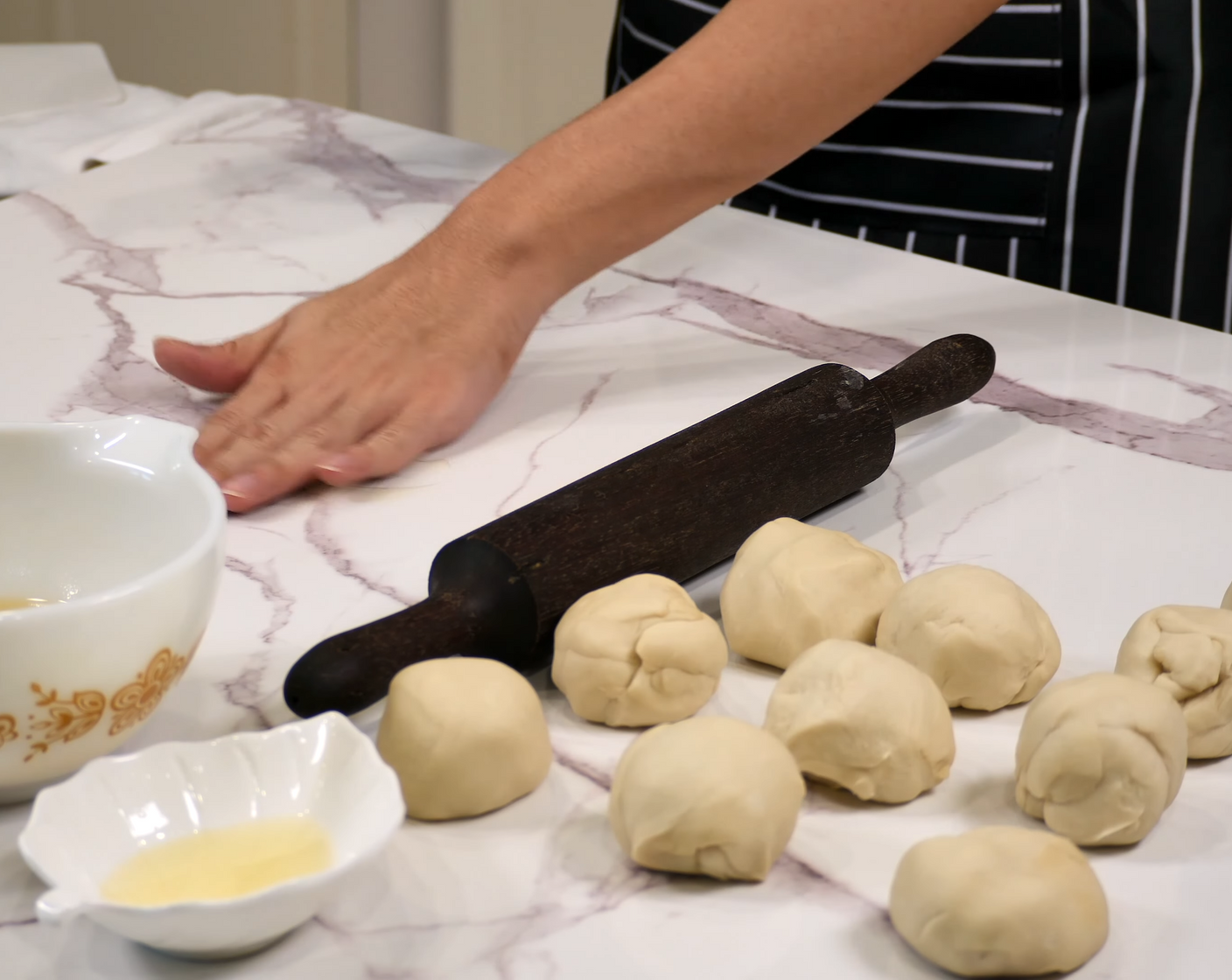 step 6 To layer the dough, oil the surface of your countertop and your rolling pin with some vegetable oil.