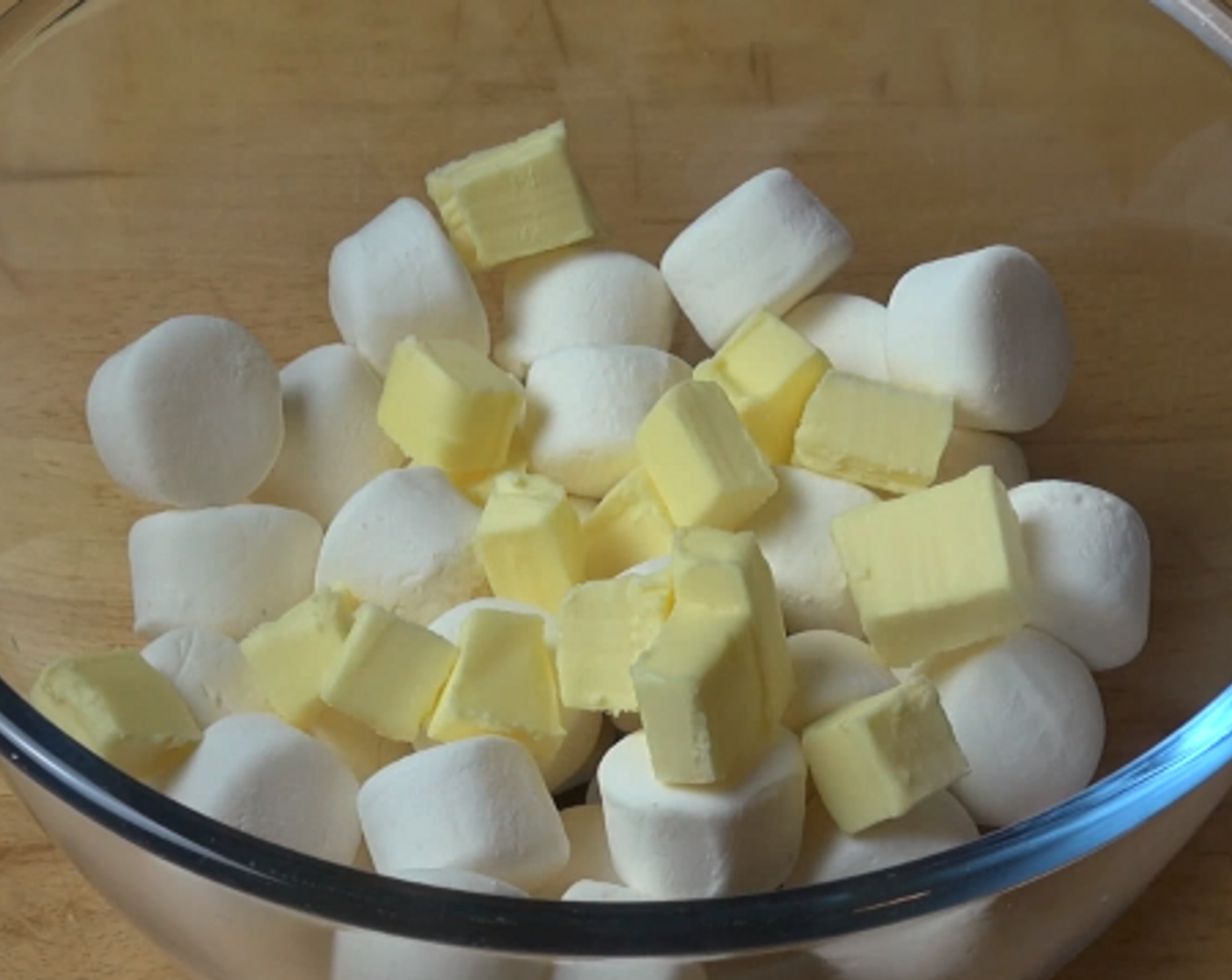 step 1 In a bowl, add Marshmallows (7 oz) and chopped, Unsalted Butter (1/2 cup). Microwave on high for about a minute. Stir every 30 seconds until smooth.