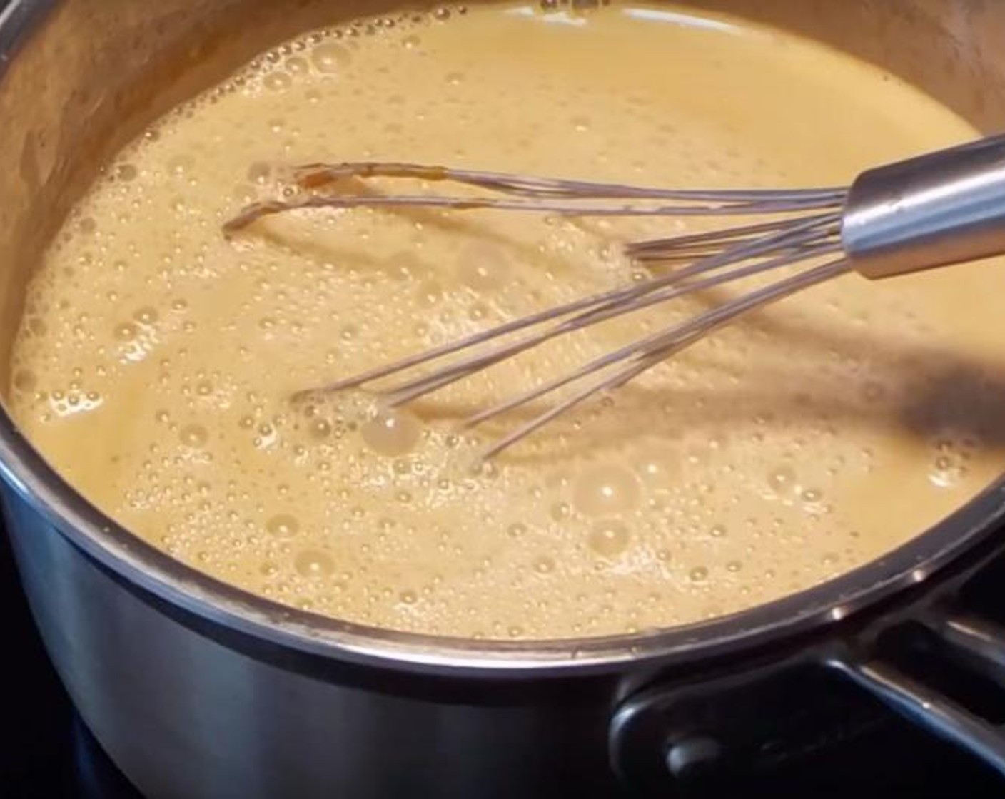 step 2 Put the mix back on heat. Add Heavy Cream (2 cups) and Whole Milk (1 cup). Put it on low heat and bring it to simmer. In a separate bowl, beat Eggland's Best Classic Eggs (6). Slowly add a couple spoonfuls of the sugar mixture to the eggs and whisk them together. Add around half a cup or eight tablespoons in total. Stirring quickly, add back the egg mixture to the pot. Bring the heat to medium and bring it to boil.