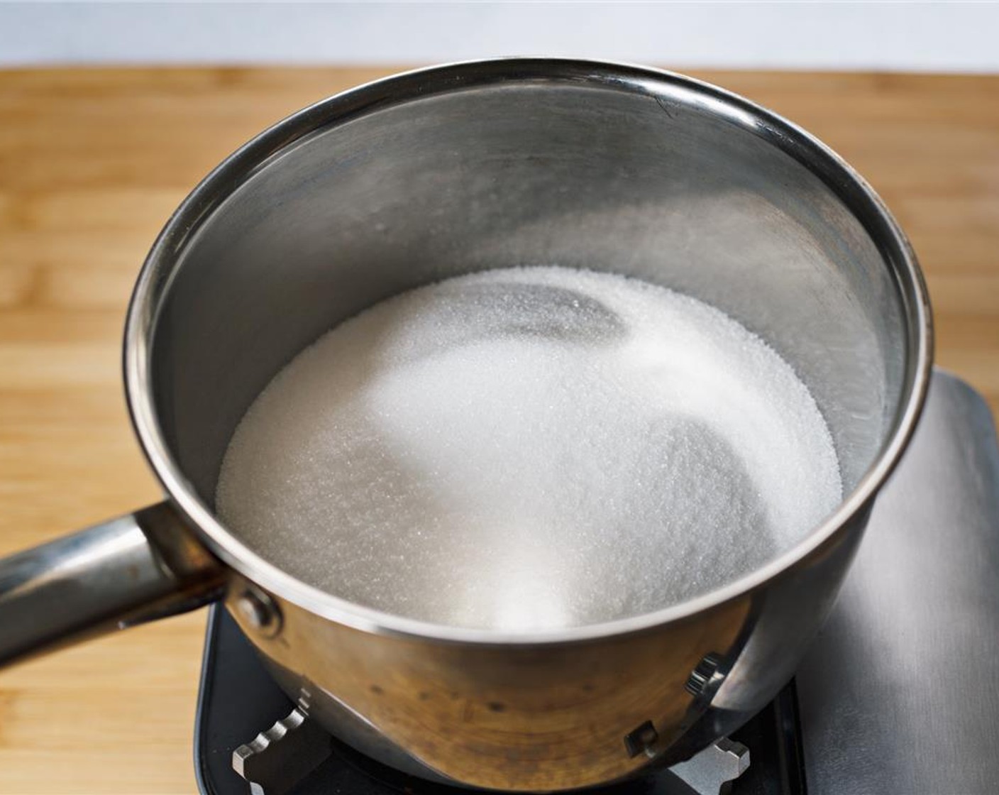 step 13 Prepare the meringue by putting Caster Sugar (2 1/2 cups) into a saucepan.