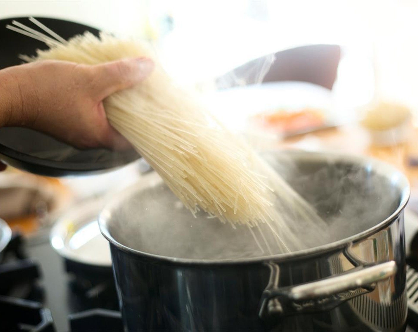 step 8 Bring eight cups of water with Salt (1 Tbsp) to a boil in a medium saucepan. Once water is at a fast boil, add the Rice Noodles (1 pckg). Stir and cook for five to six minutes until cooked but still with a little bite.