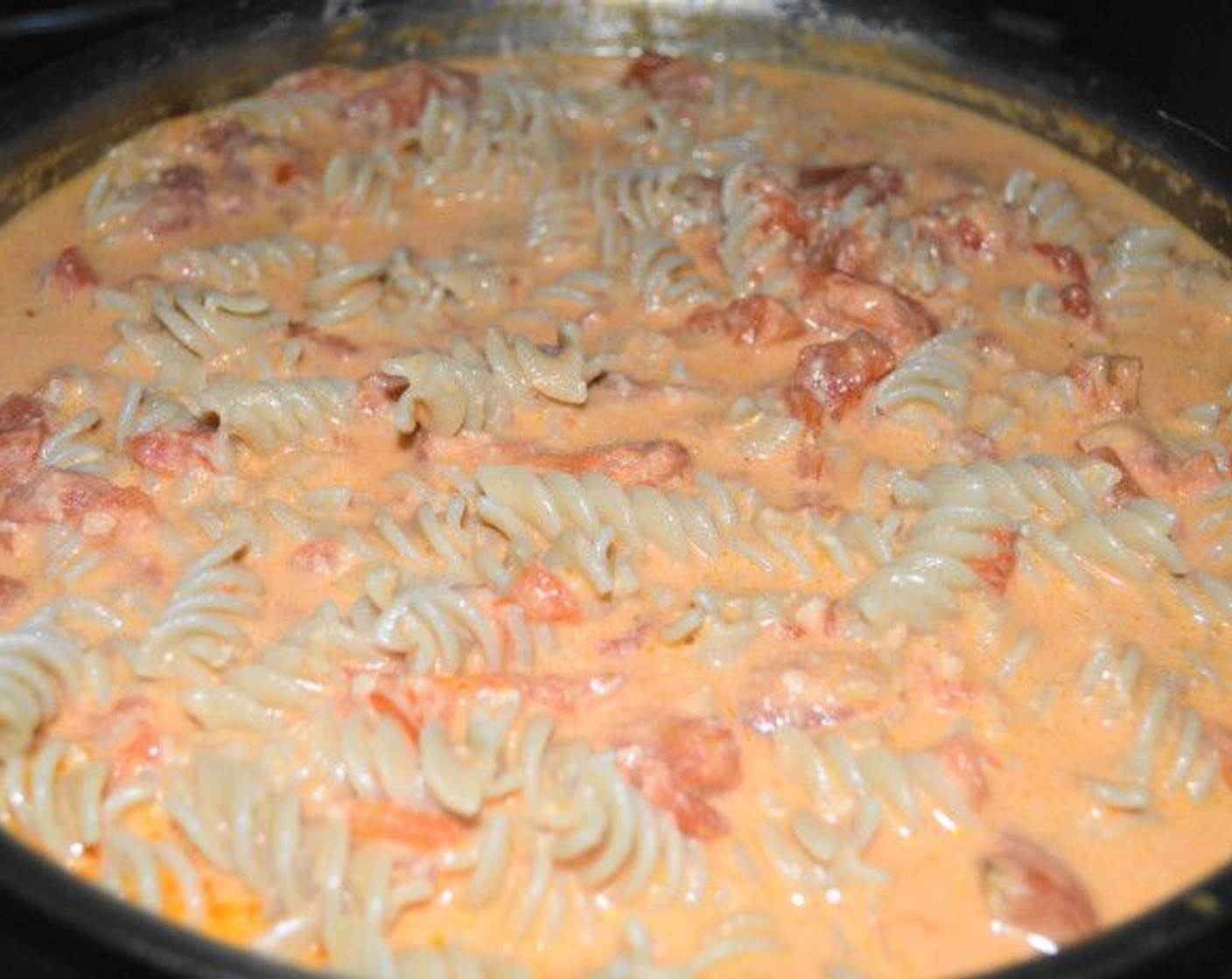 step 8 Drain the pasta, transfer it into the pan of sauce and toss it all together.