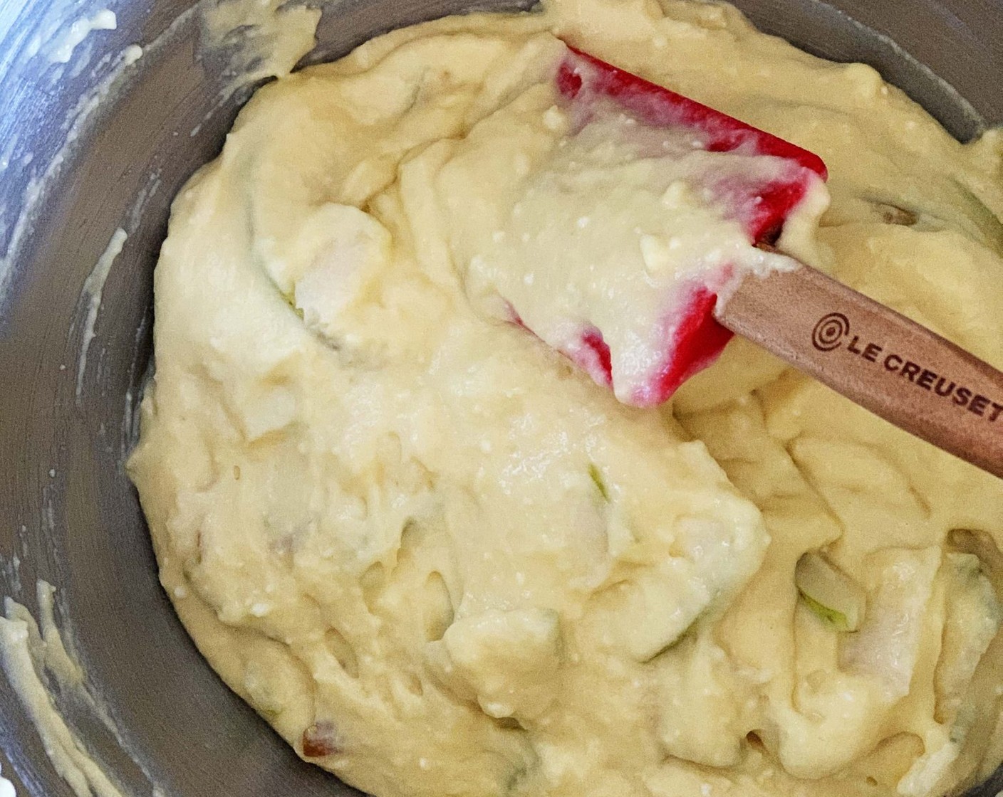 step 5 Thinly slice the Pears (2) and add the slices of one pear into the batter, folding them in gently.