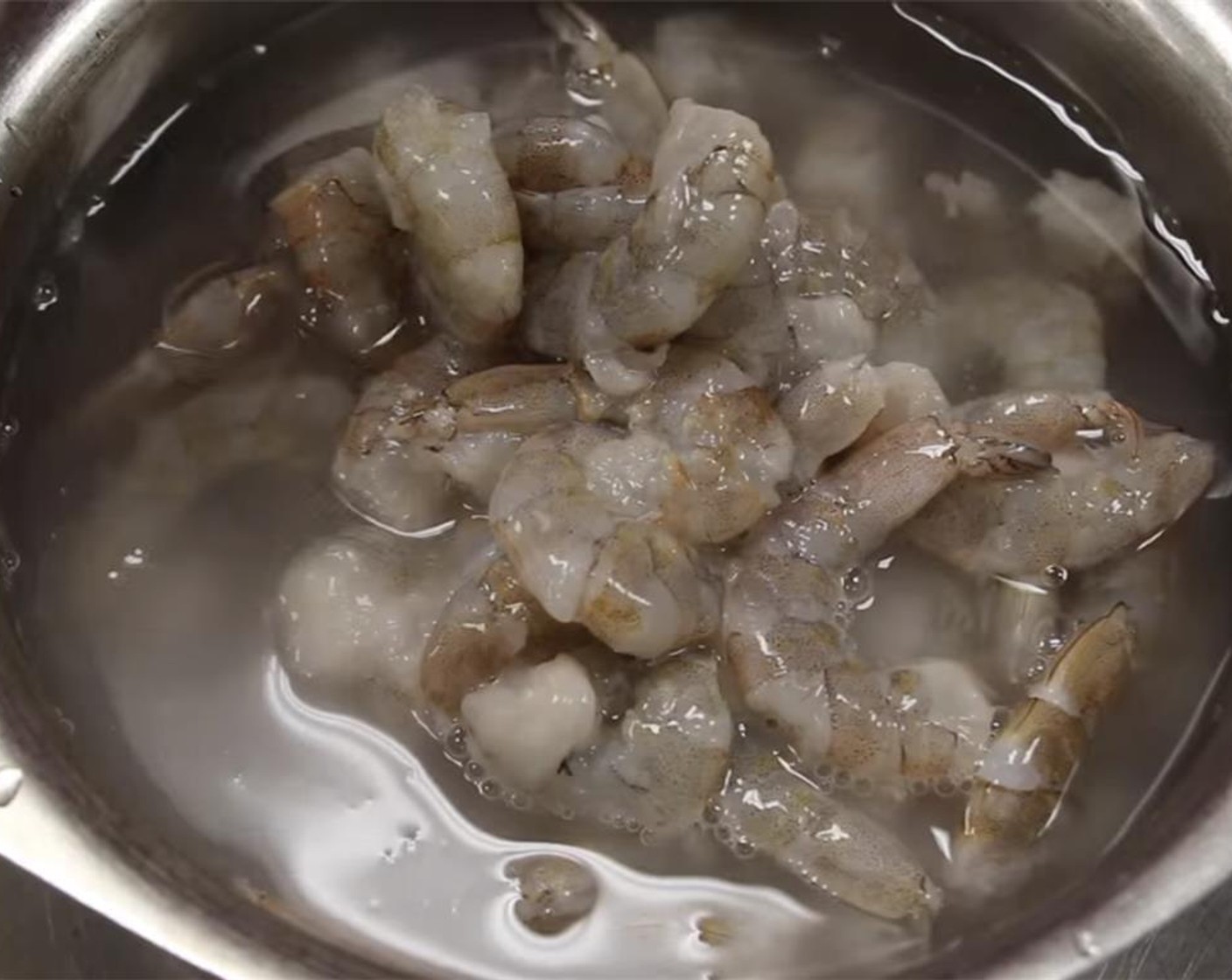 step 9 Using your hands, wash the shrimp with water, drain then set aside.