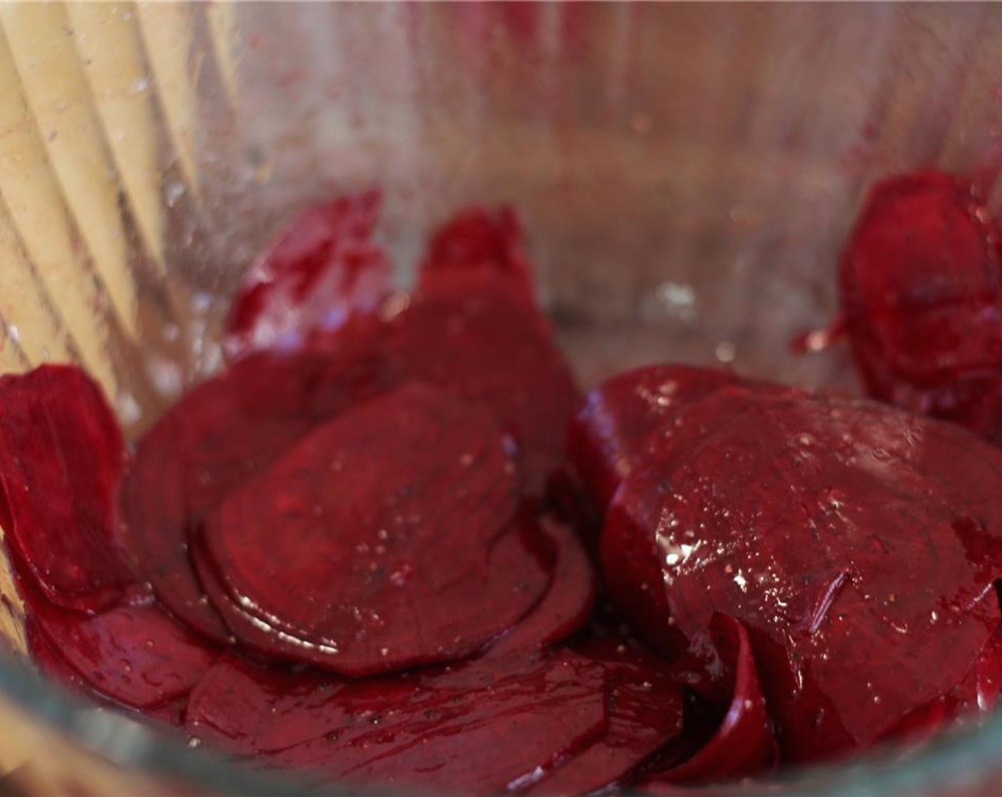 step 8 Toss the beets slices with Olive Oil (1 tsp) and a pinch of salt. Spread evenly on the baking rack and place into the oven to bake for about 20 minutes, or until the chips are cooked through and crispy.