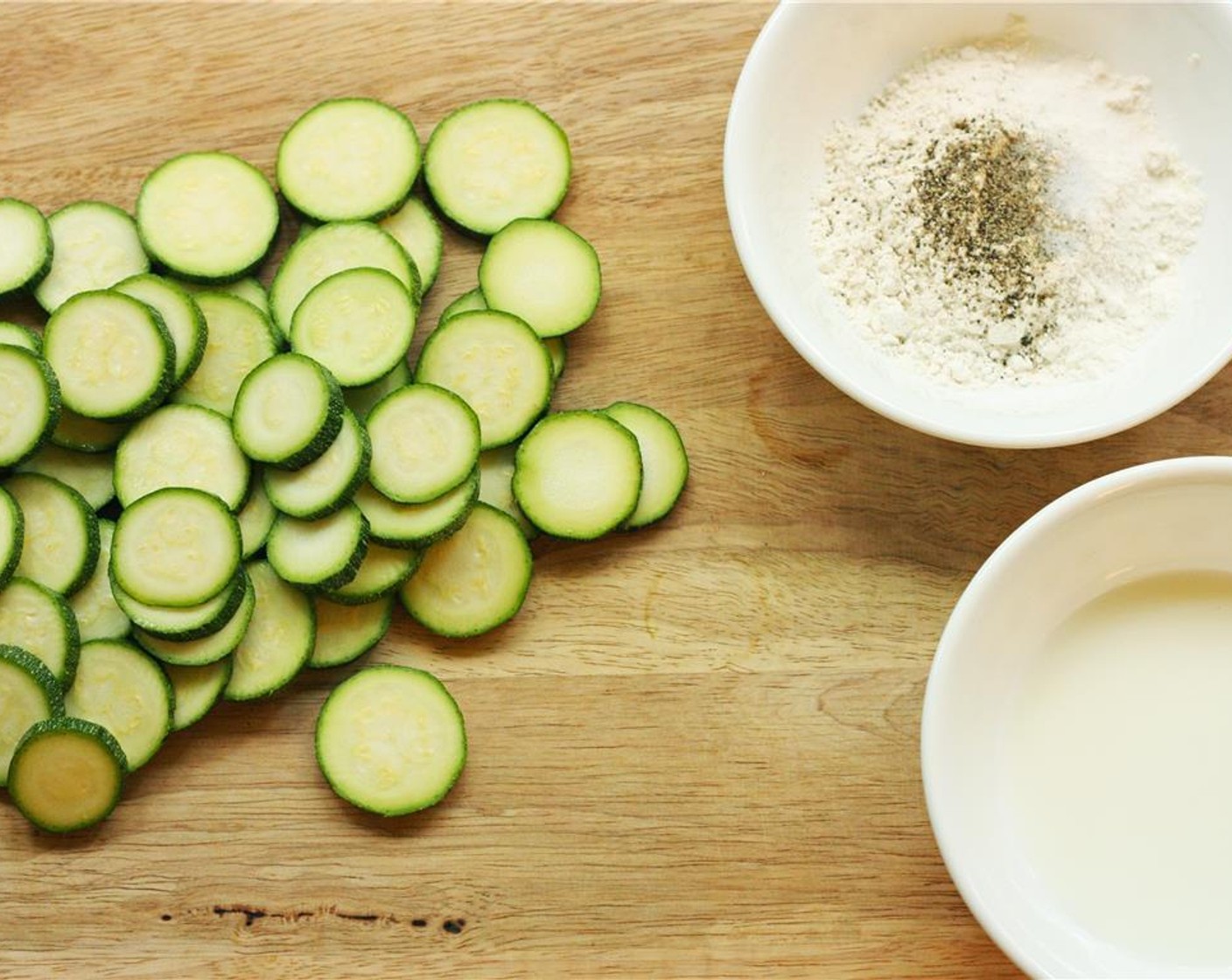 step 1 Wash and pat dry the Zucchini (2). Slice medallions of zucchini no thinner than 1/4-inch.