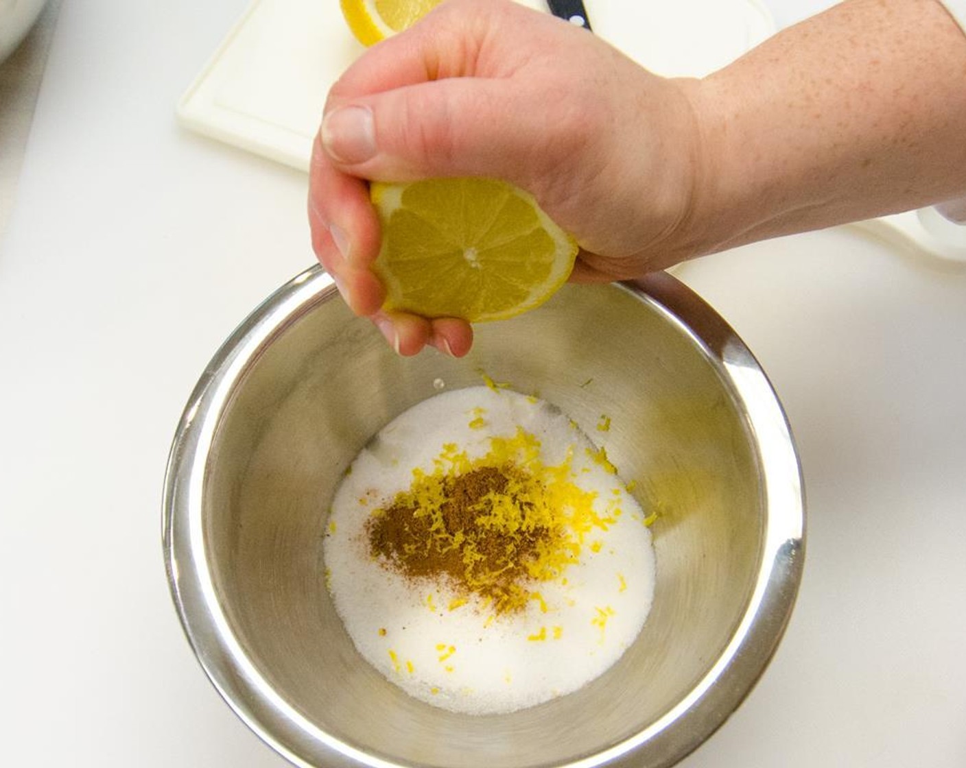 step 11 Slice the zested lemon in half and add Lemon Juice to the bowl.