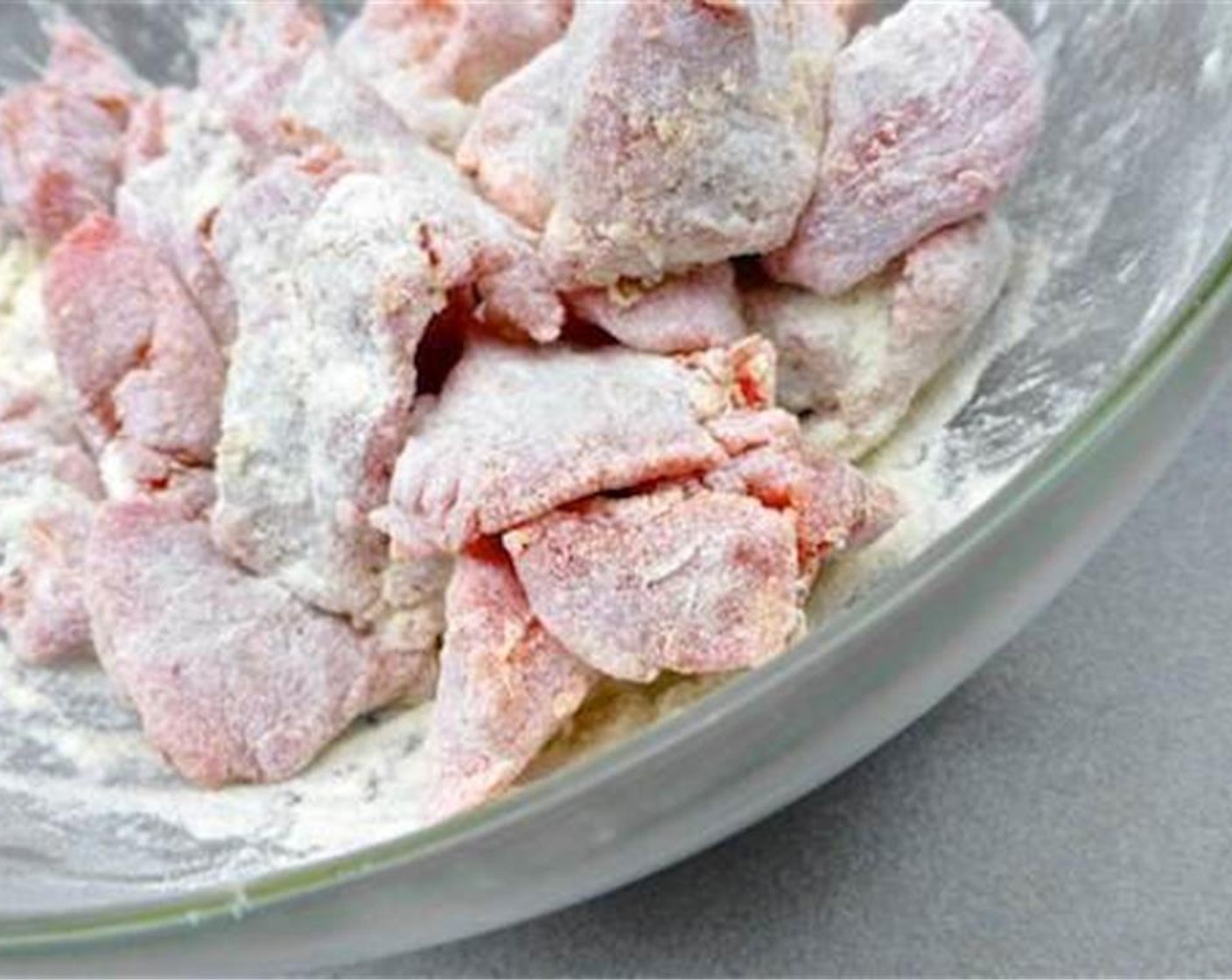 step 1 Dice the Beef Chuck (2 lb) into bite-sized pieces. Transfer them to a large bowl and sprinkle with the plain All-Purpose Flour (3 Tbsp). Season with a good pinch of Ground Black Pepper (to taste) and Salt (to taste).