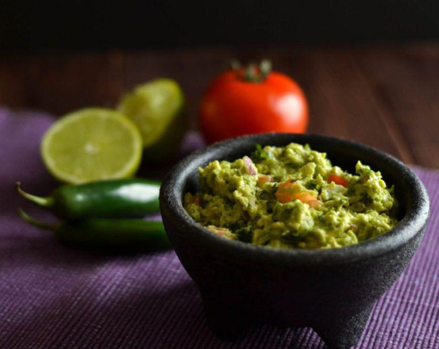 step 2 Add Lime (1/2), Red Onion (1/2), Salt (to taste), Ground Black Pepper (to taste), Serrano Chili (1), and Fresh Cilantro (1 Tbsp). Mix well using a fork. If you like your guacamole chunky like I do, be careful not to break up the avocado too much.