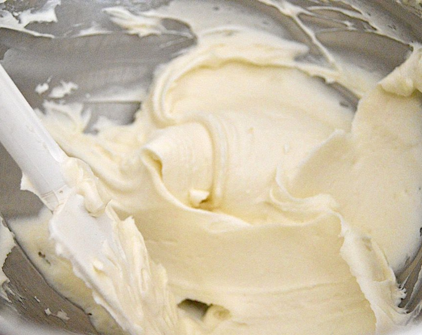 step 7 Combine the Philadelphia Original Soft Cheese (1 cup) and Unsalted Butter (1/2 cup) in the mixer bowl. Beat them together thoroughly, then turn the speed to low and slowly add the Powdered Confectioners Sugar (3 3/4 cups) and Vanilla Extract (1 tsp) until you have a rich, smooth frosting.