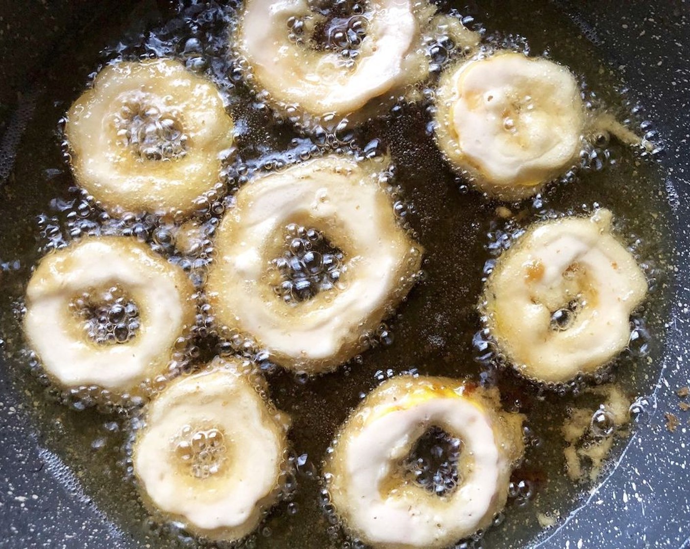 step 6 Fry the rings until golden, about 1 to 1 1/2 minutes on each side. Remove and drain on a rack or a paper towel-lined plate.