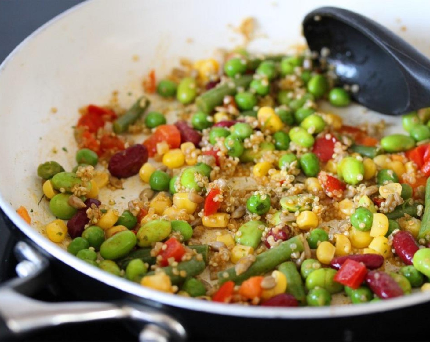 step 1 Place the Frozen Zesty Bean Quinoa (1/4 pckg) into a dry frying pan over a low heat and stir occasionally until warmed through.