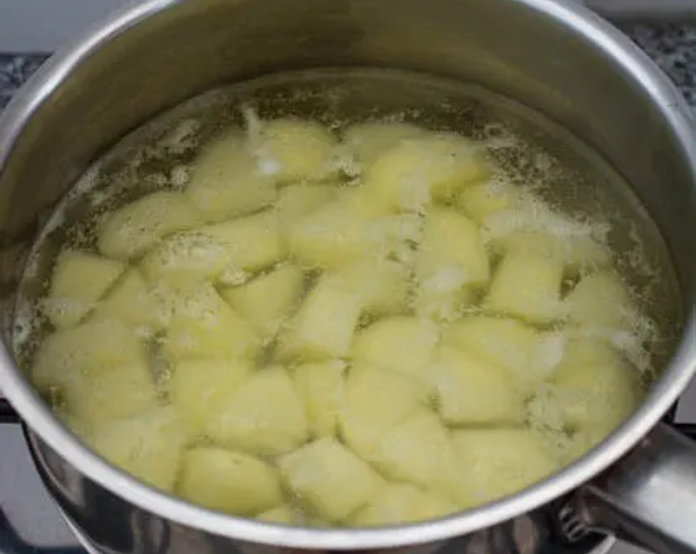 step 2 Place the potatoes in a small saucepan and fill the saucepan with just enough water to cover the potatoes. Bring the water to a boil and allow the potatoes to boil for 5 minutes. Drain the water and set the potatoes aside.
