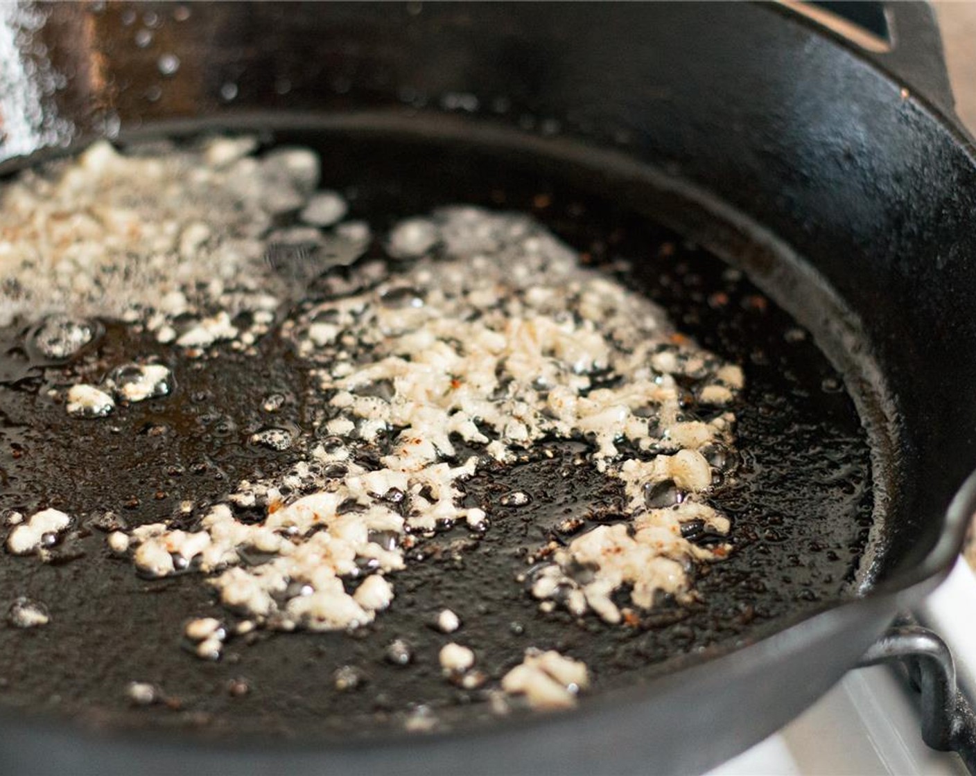 step 8 Reduce heat to medium-low. Add the garlic and saute until fragrant, about 30 seconds.