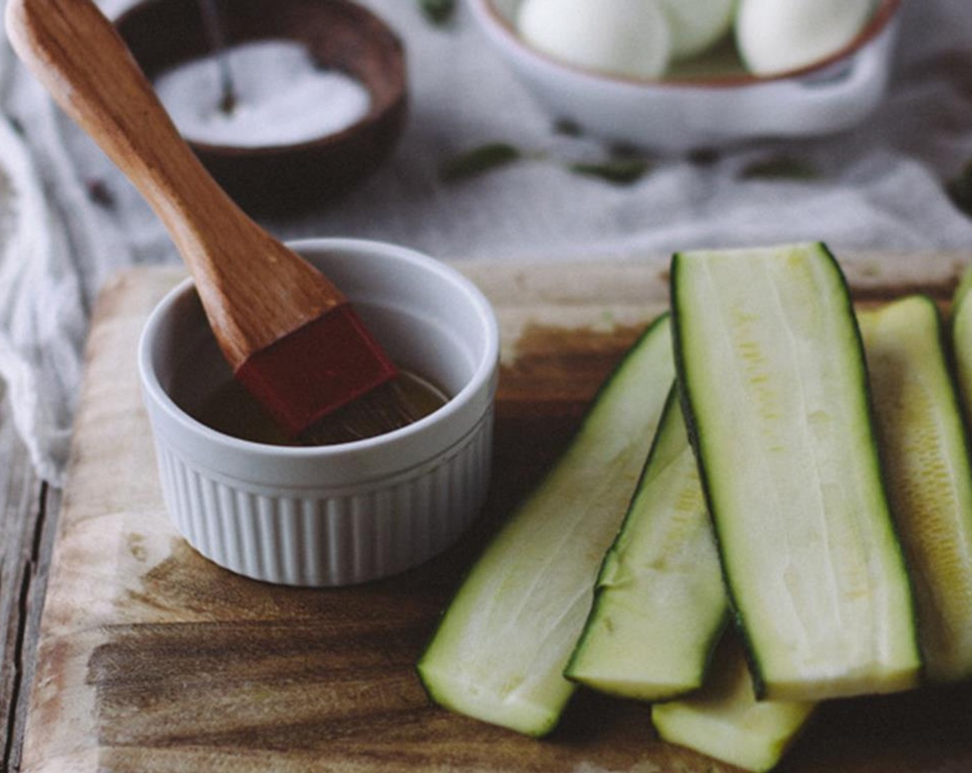 step 9 Brush both sides of each zucchini slice with Olive Oil (2 Tbsp).