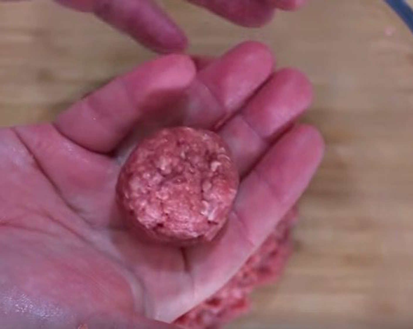 step 14 In a large bowl, add 80/20 Lean Ground Beef (1 lb), Salt (1 tsp), and Olive Oil (1 Tbsp) Mix well, then roll into golfball-sized meatballs.