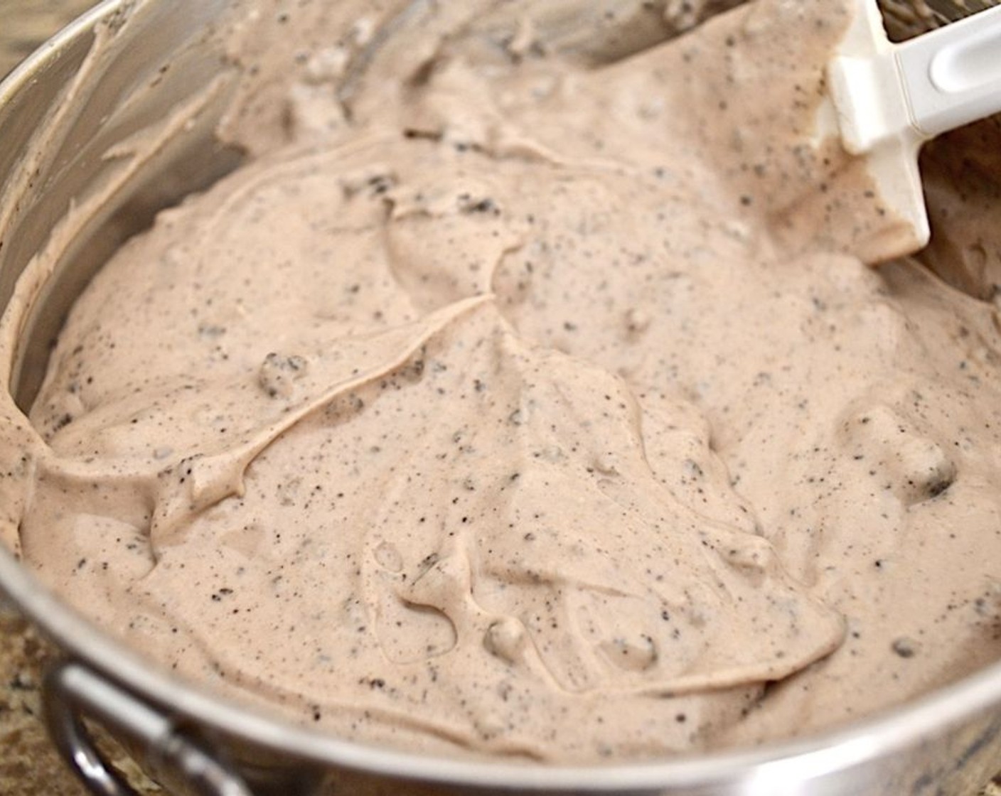 step 4 Combine the Cream Cheese (1 cup), Mascarpone Cheese (1 cup), Plain Greek Yogurt (1 pckg), Granulated Sugar (1/2 cup), Eggland's Best Classic Eggs (2), Unsweetened Cocoa Powder (1 Tbsp), and Vanilla Extract (1 tsp) in a mixing bowl and use a hand mixer to whip it all together. Alternatively, you could use the stand mixer with a paddle attachment here. Use a spatula to fold in the oreo crumbs.