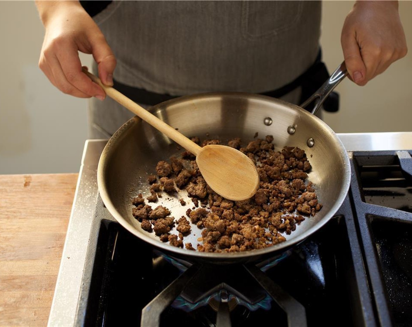 step 6 Heat Olive Oil (1 Tbsp) in a pan over medium high heat. Add Onion (1/2) and sauté for 2-3 minutes until caramelized. Add 85/15 Lean Ground Beef (8 oz) and cook, breaking up beef with a spoon into medium sized pieces while cooking. Cook until cooked through.