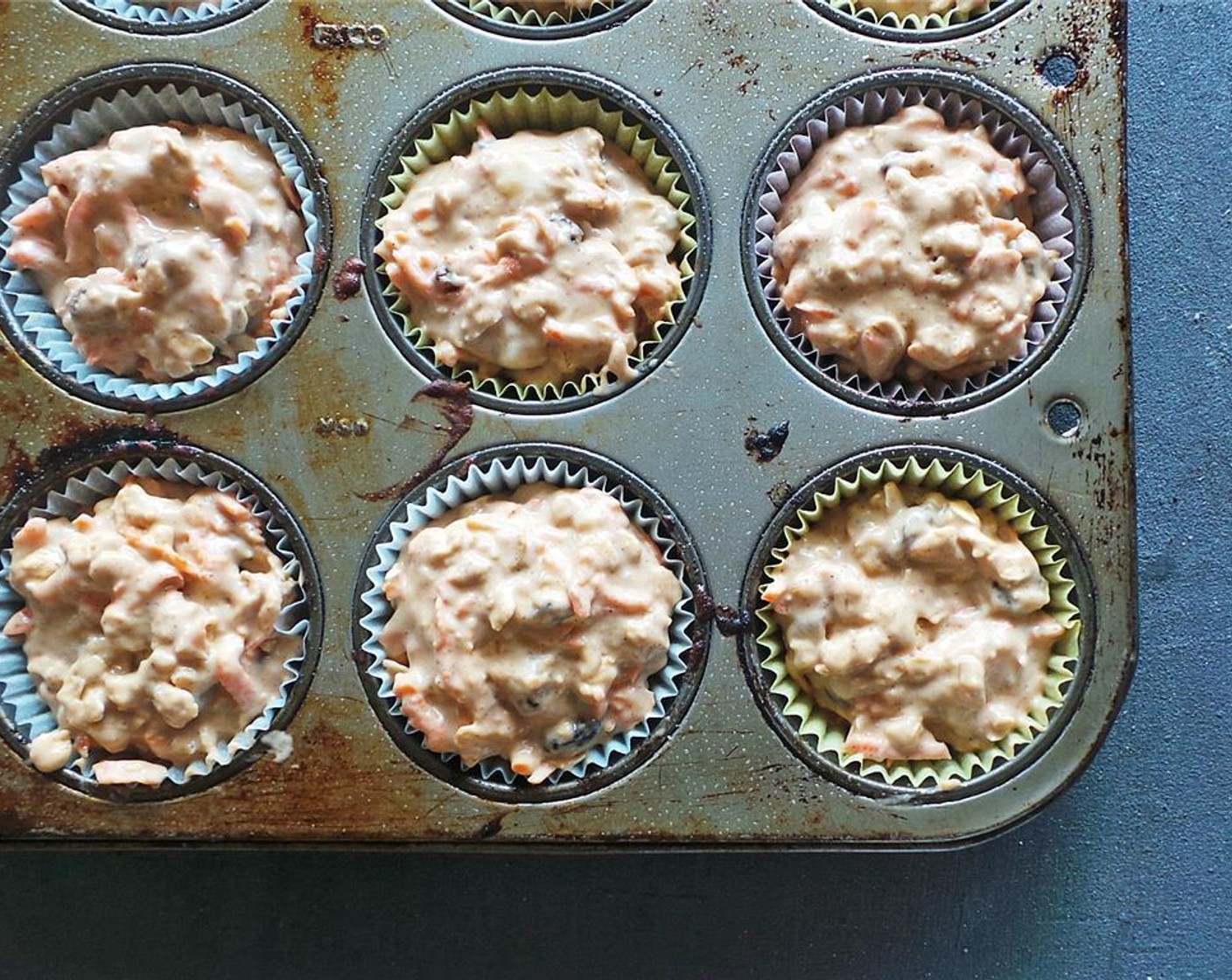 step 6 Spoon equal amounts of batter into each muffin tin. I like mine big so I fill mine up all the way!