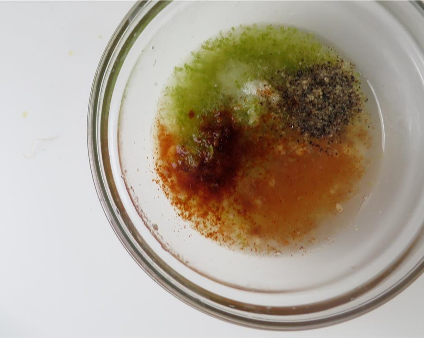step 4 For dressing, combine lime zest, lime juice, garlic, Honey (2 tsp), Chipotle Chili Powder (1/2 tsp), Dijon Mustard (1 tsp), and Olive Oil (4 Tbsp) in a small bowl. Whisk until emulsified. Add Salt (to taste) and Ground Black Pepper (to taste).