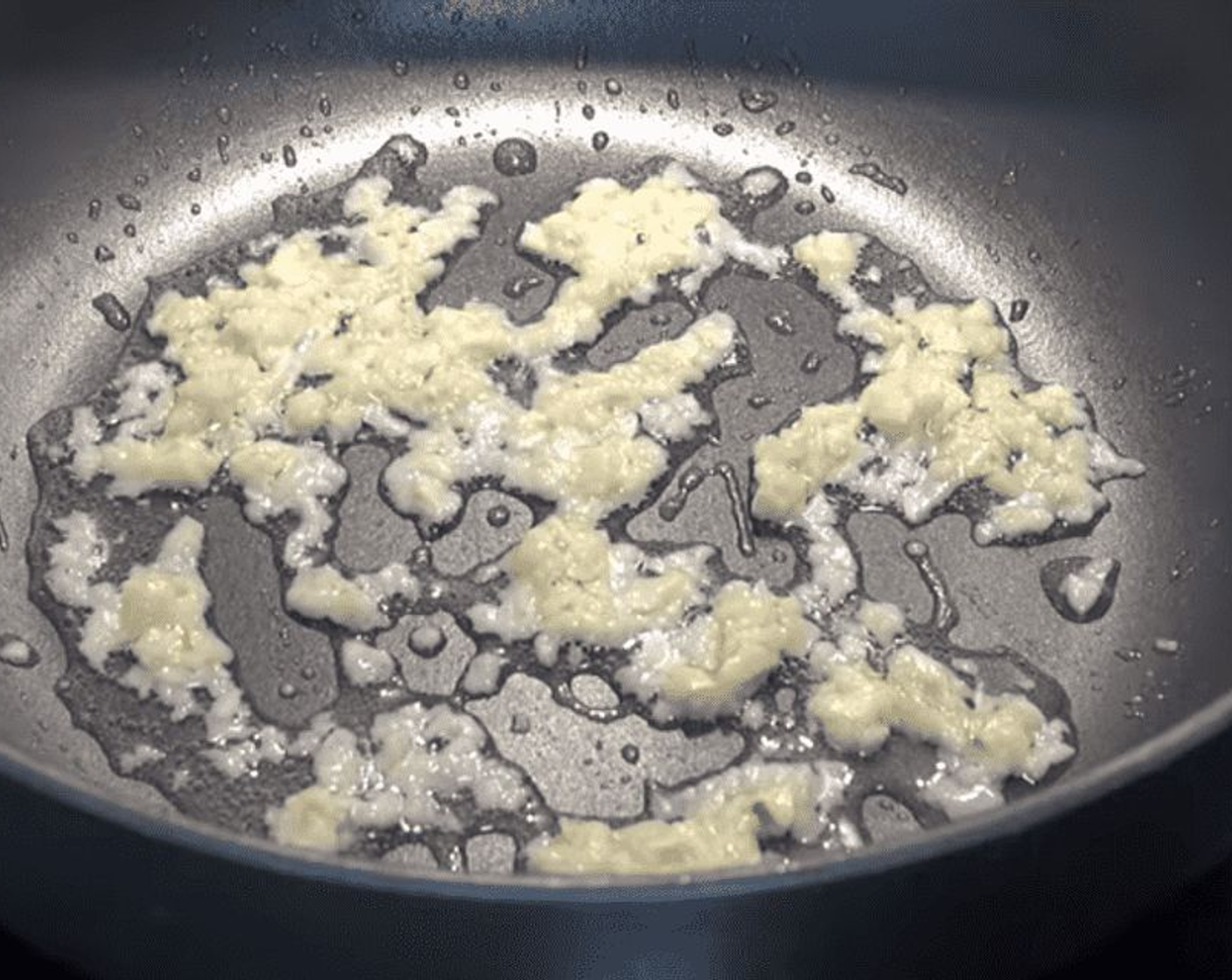 step 1 Into a large pot or deep saute pan, add Olive Oil (2 Tbsp) and the Garlic (4 cloves) and cook for a few minutes until fragrant.