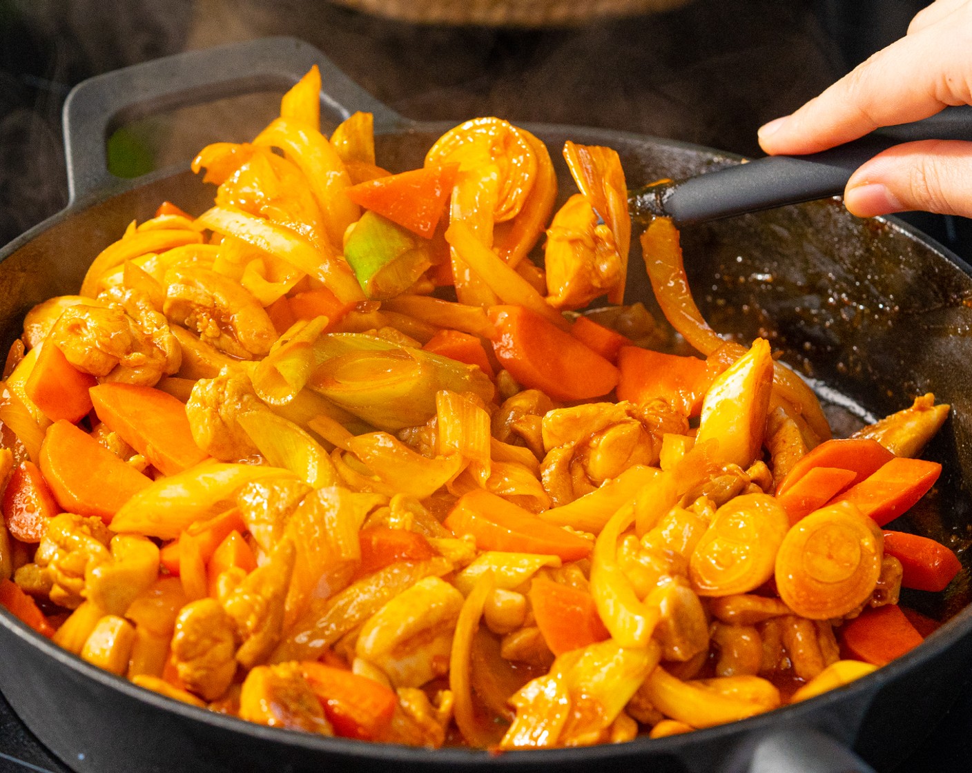 step 5 Add carrots, leeks, onion, and gochujang mixture. Cook for 4-6 minutes, stirring frequently.