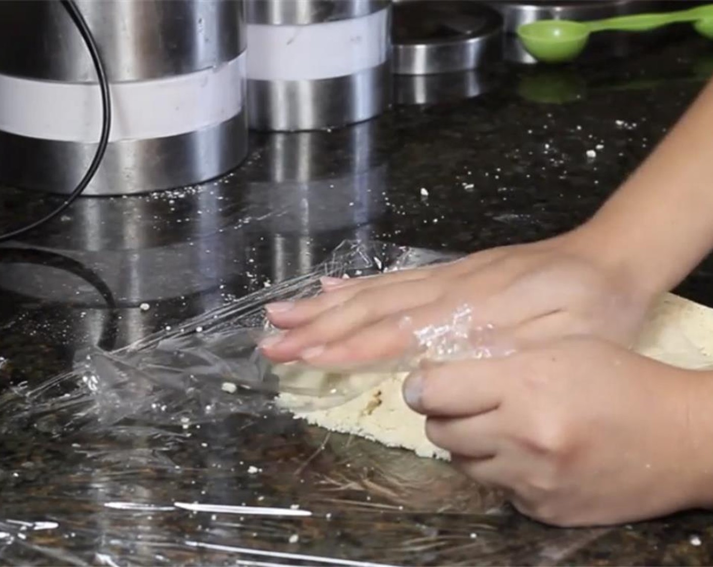 step 5 Dump the crumbly mixture onto a sheet of plastic wrap, and use your hands and the wrap to help you slightly knead it and bring it together.