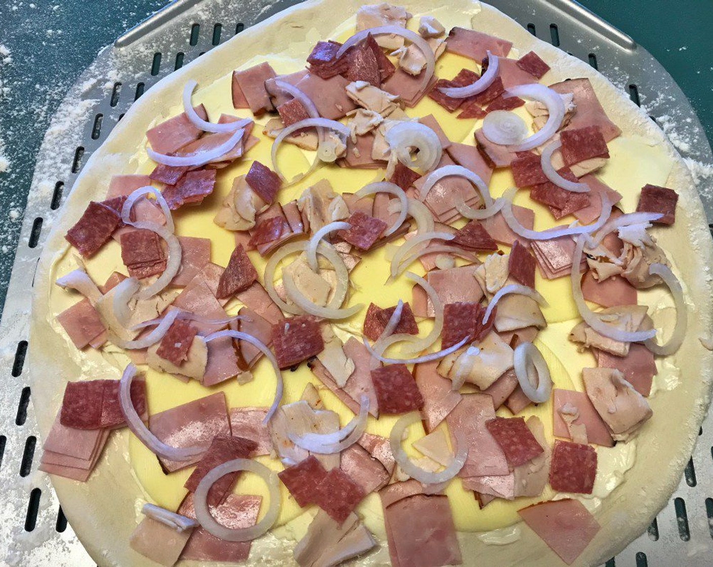 step 5 Top pizza with Deli Turkey (1/2 cup), Ham (3/4 cup), Salami (1/3 cup), and Onion (1).