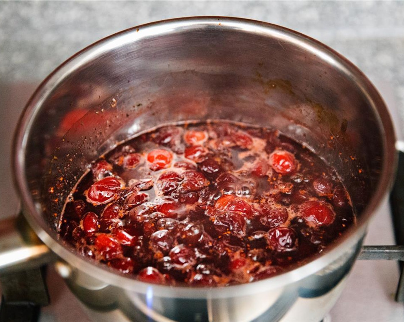step 5 Once cranberries have began to burst, your sauce is ready. Remove from the heat.
