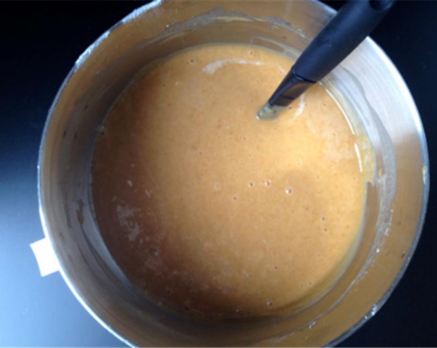 step 5 Add a little at a time to the wet ingredients, mixing after each addition until combined. Add Water (2/3 cup), a little at a time, and continue mixing on low speed until batter is smooth. Pour batter evenly into each of the loaf pans.