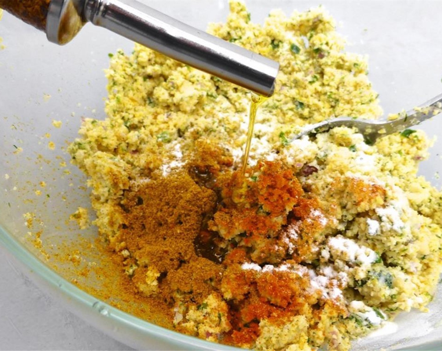 step 6 Stir well. Add the Baking Powder (1/2 tsp). Season with the Ground Cumin (1 tsp), Garam Masala (1 tsp), Simply Organic Cinnamon, Ground (1/4 tsp), Ground Turmeric (1/2 tsp), and a dash of Ground Black Pepper (to taste) and Salt (to taste). Drizzle with Olive Oil (as needed).