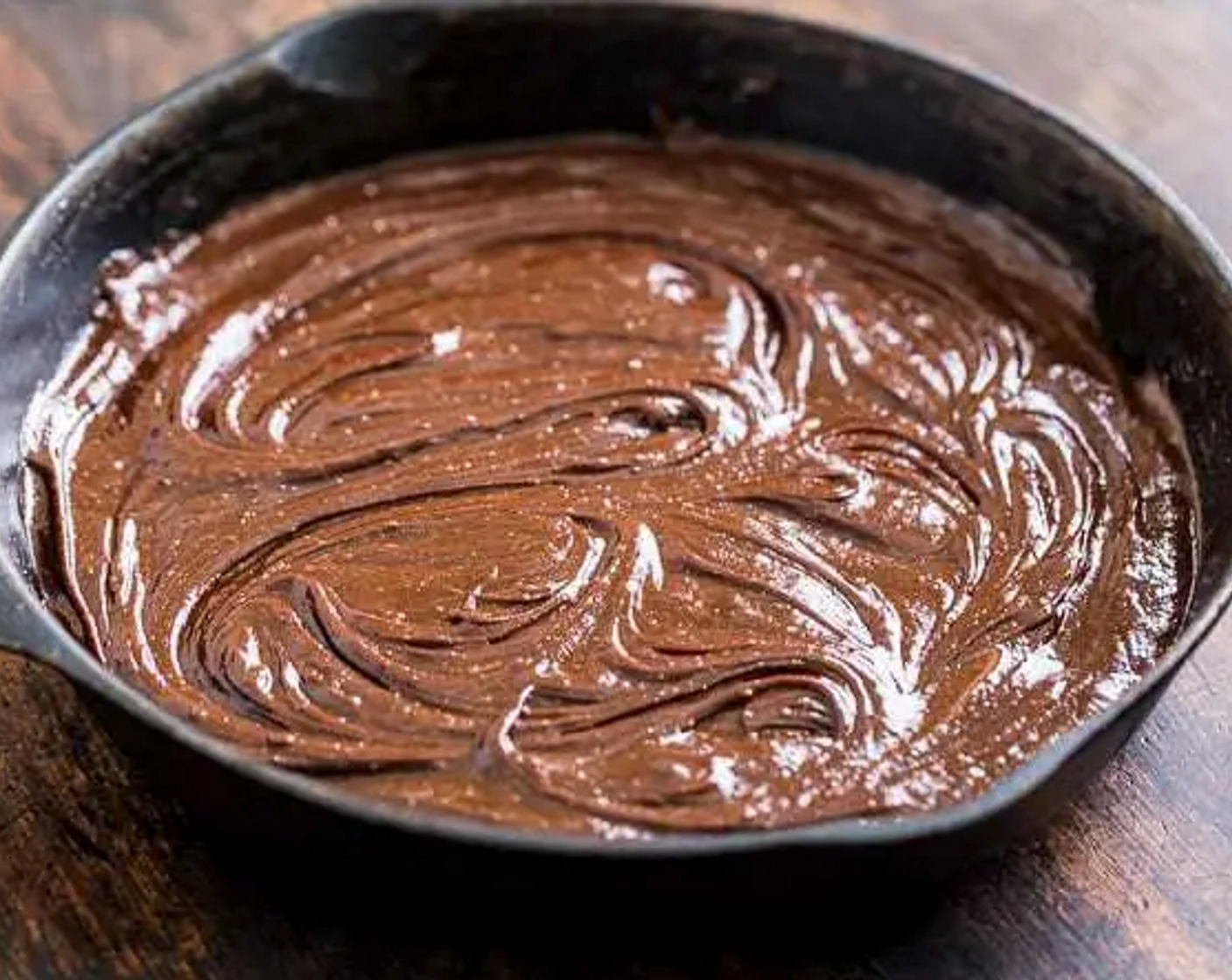 step 4 Place the pan in the oven and bake for 15-20 minutes. You want to take it out when it is still fudgy and soft inthe middle because it will continue to cook after you take it out of the oven.